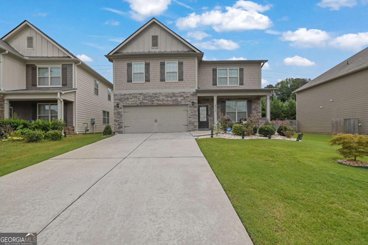 Welcome to this charming 5-bedroom, 4-bathroom home in the desirable Centennial Lakes community in Acworth! Better than brand new, this house was built in 2018 and is in immaculate condition ready for your family to enjoy. Featuring wide plank LVP flooring on the main level and the stairs. The living room and a separate dining room with coffered ceilings provide an elegant entrance that flows seamlessly into the kitchen. The Chef's dream kitchen boasts white cabinets, stone countertops, vent hood, island and a breakfast room with a views of the fireside family room, making it an ideal space for both cooking and entertaining. The oversized primary bedroom is upstairs with a cozy sitting space. While the ensuite bathroom includes a separate shower and tub, double vanities, and a large walk-in closet. Another two full bathrooms with glass enclosed tub & showers are on the same level. An extensive remodeling worth over $60,000 has just been completed on this updated single-family house. The spacious backyard with plenty of green space is ready for your outdoor gatherings. The home also includes an attached 2-car garage. Located in a great area with easy access to I-75, Downtown Acworth. You'll love living in this community full with great amenities! Enjoy the convenience of quick access to I-75, Downtown Acworth with shopping and dining just minutes away. A MUST SEE!