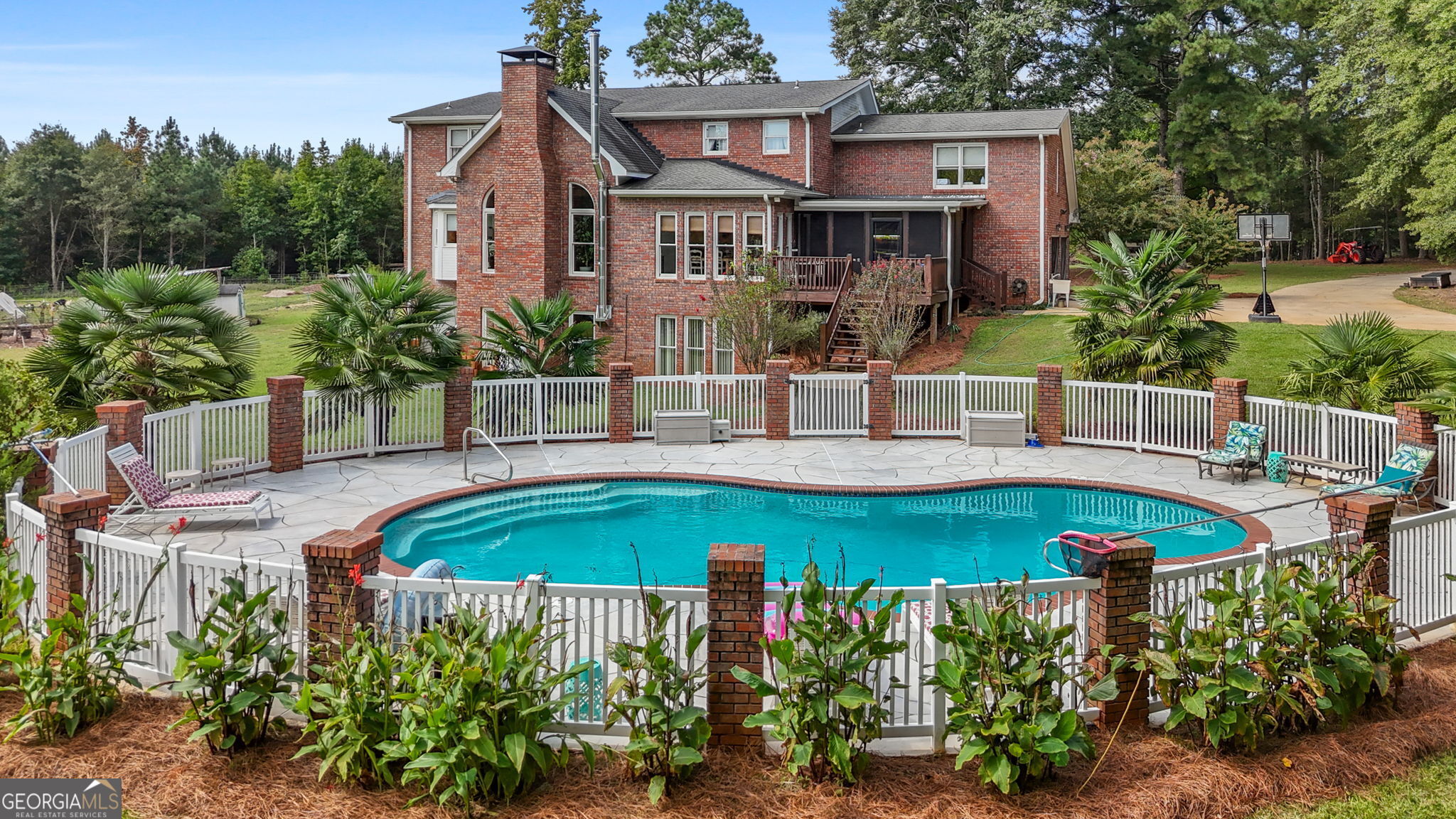 "THE CHANCE SELLS TEAM" presents to you this Beautiful Brick Cape Cod Estate on 25.41 Private Acres with Pool, Barns & More! Check out this gorgeous all-brick Cape Cod-style home, perfectly situated on 25.41 private acres. This spacious two-story home features a fully finished basement, sparkling 18x36 ft inground pool, and extensive outdoor amenities-offering both luxury and functionality for those who love privacy and space. Interior Highlights: Newly Remodeled Kitchen (2023): Absolutely stunning and loaded with cabinetry! Features include a chef-style gas stove, custom vent hood, flush-mount refrigerator, and tons of prep space-perfect for entertaining and everyday living. Primary Suite on Main: Spacious bedroom with walk-in closet and full en-suite bathroom. Additional Bedrooms: Upstairs you'll find 3 large bedrooms, 2 full baths, an office, and a loft with custom built-in bookshelves. Terrace Level (Basement): Fully finished with a large open area, full bathroom, storm shelter, and a 3rd garage/boat door with storage. ((DUAL HOT WATER HEATERS)) Exterior & Property Features: Fire Pit Area, Perimeter Fencing (2023): Fully fenced 25.41 acres with an electric solar-powered gated entrance. Outbuildings & Extras: Includes multiple sheds, pole barn, raised garden beds, and RV electrical hookup (2024). New Well (2024): In addition to county water, a high-powered well was added for extra water reliability. Whole-House Water Softener (2024) and Generator Hookups for peace of mind during outages. Utilities & Efficiency: Home is total electric with the gas stove running on propane only. Tree clearing, garden installations, and new barns/outbuildings all completed in 2023. This home offers a rare blend of upscale living, modern convenience, and homestead potential, all in a tranquil, private setting. Whether you're looking to entertain, garden, raise animals, or just enjoy serene country living, this property has it all-move-in ready and loaded with upgrades! Give us a call for your "CHANCE" to purchase this beautiful home today!! Thanks, Chance.