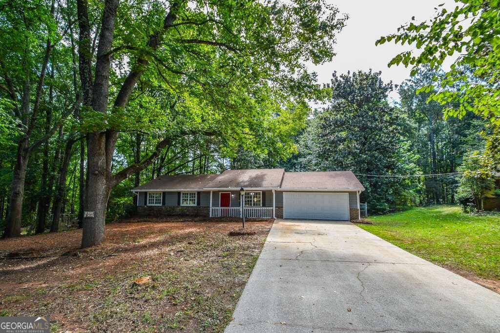Photo of 110 E Country Woods Drive, Covington, GA 30016 (MLS # 10824579)