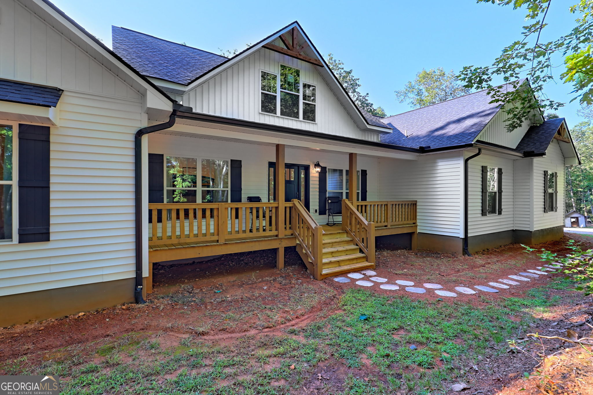 Tucked away atop an unrestricted 2.00 acre parcel, this modern farmhouse, built in 2022, is the perfect balance between serene mountain living & access to town. With numerous custom upgrades, and built with thought in mind, this home features one-level-living at its finest! Once you walk onto the front covered porch, you will instantly feel at peace with nature all around you. Entering the home, you are met by two flex spaces. Home office, sitting area, formal dining room... The opportunities are endless! From there, you venture into your main living area full of windows and natural light. With vaulted living room ceilings, accent wood beams, a shiplap fireplace with custom wood mantle, this living area is sure to impress. An open concept kitchen and breakfast nook offer the ability to entertain with ease. The kitchen offers an oversized island, granite countertops, backspace accents, and more. From the kitchen you will find a large walk in pantry/laundry room and entry from the oversized 2 car garage. The Master suite is fit for comfort and luxury with tons of space and upgrades. The master bath has a floor to ceiling custom, tile shower, his and her closets, a separate toilet room, extended double vanity, and plenty of storage! On the other end of the home, you have access to your back patio and large, secondary bedrooms. Each bedroom contains a large walk-in closet and views of wildlife and the serene outdoors. Need more space? The basement, with separate exterior entrance, doubles your square footage and is ready for you to make it your own! Plumbed for a kitchenette & bathroom, you can create additions you may need or rent the space for added income! ADDITIONAL UPGRADES FOR THIS HOME INCLUDE: 2x6 exterior framing for added insulation, poured basement walls, updated light fixtures, interior insulation, EV charging capabilities in garage, partially paved driveway, gutter guards, landscaping, & more! Steps from USFS and less than 10 min from town!