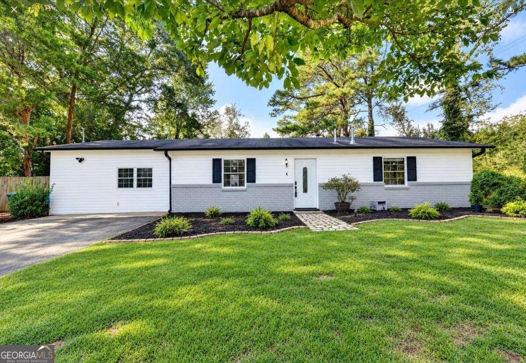 Photo of 4391 Bryant Drive SW, Lilburn, GA 30047 (MLS # 10849986)