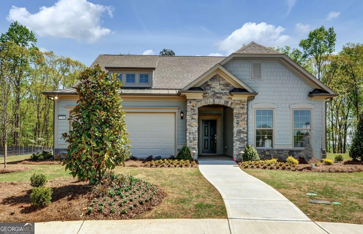 Model home Abbeyville, a stunning single-story home designed for both comfort and style. The heart of the home is a beautifully integrated kitchen, with stained cabinets, and gleaming granite countertops, and a spacious dining area, perfect for entertaining or casual family meals. Flow seamlessly into the inviting gathering room, where rich dark hardwoods run throughout, creating warmth and elegance in every corner. With its thoughtful layout and timeless finishes, this home is the perfect blend of functionality and charm. Don't miss your chance to make this model home yours!
