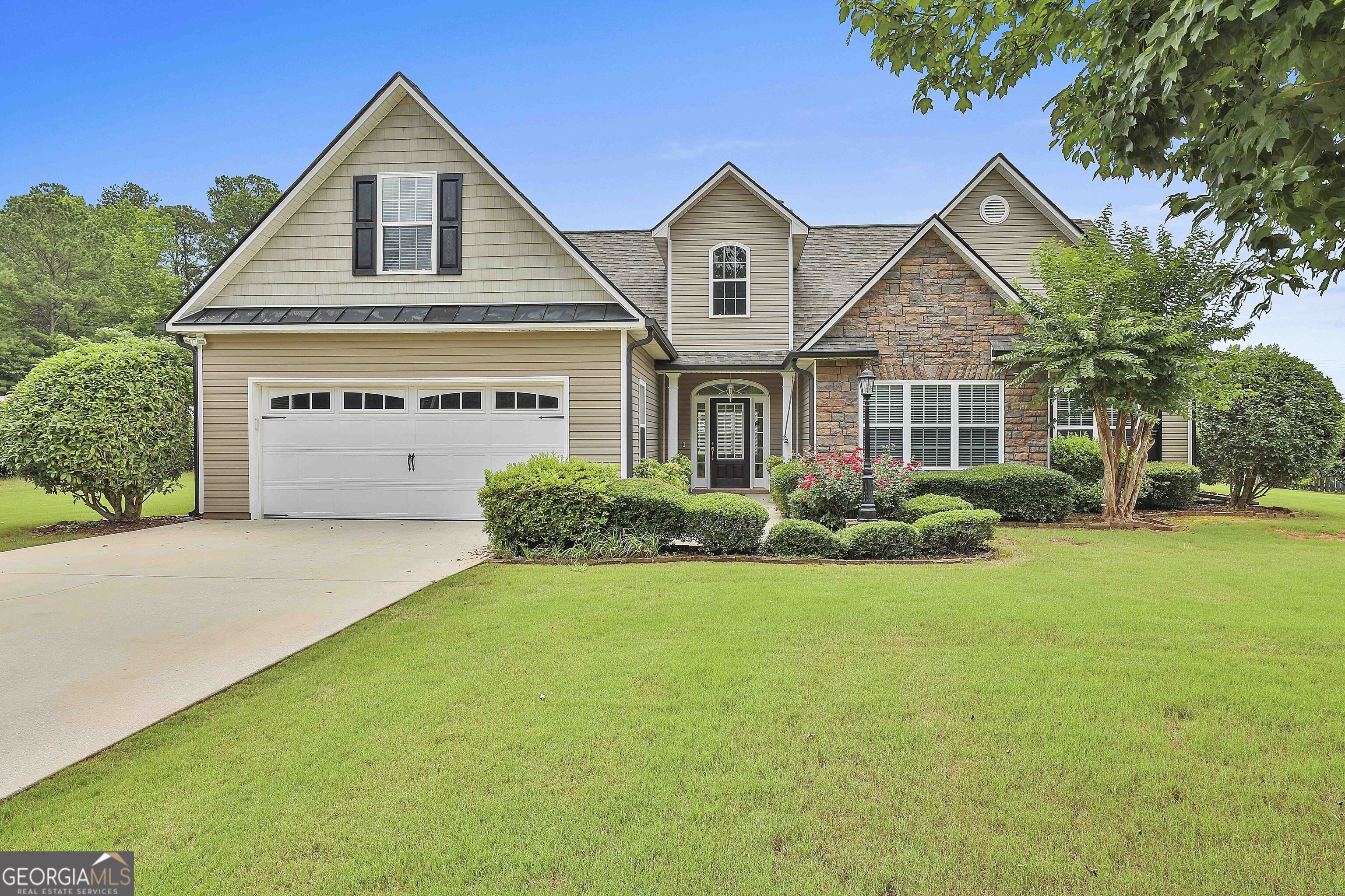 THIS MUST SEE RANCH W/ BONUS OFFERS A SWEEPING LONG DRIVEWAY, GROOMED LAWN & GORGEOUS LOT! Plus the interior has NEW PAINT inside throughout entire home for a fresh, light look. Enjoy wide Foyer entrance that opens to beautiful Family rm w/ vaulted ceilings & stacked stone Fireplace. Big Kitchen w/ an abundance of tall cabinets, granite counters and NEWer SS Appliances inc Frig + stove offers air fryer/convection feature. Dining room/Living rm combo keeps everyone in the mix. Huge Laundry rm/Pantry includes Washer/Dryer for your convenience + a place to organize & store your things. Primary + 2 bedrooms on the main. Primary Bathrm offers soaking tub, dbl vanities & sep shower. NO CARPET on the main!! Hidden stairs lead to Bonus rm up w/ LVP flooring. Bright windows adorn the back of home offering views of the deep, level backyard w/ lush lawn. Oversized patio is shaded from the afternoon sun - perfect for your outdoor entertaining. More storage w/ roll up door shed for lawn tools and Barn/outbuilding too! NEW ROOF, NEWer HVAC, Septic just PUMPED & NO HOA! This home has it all and is MOVE IN READY! Check out video walk through. Eligible for 100% USDA Financing!