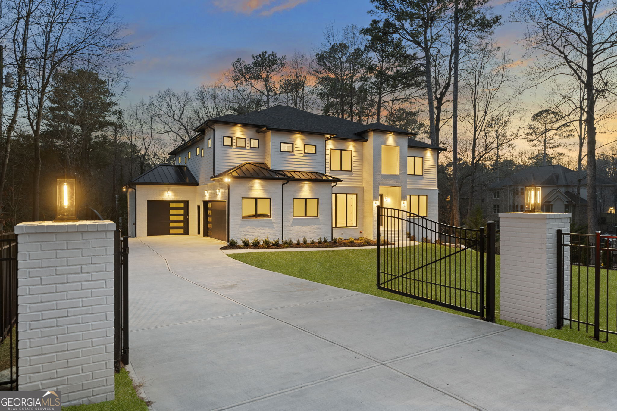 Solid-built gated estate on over half an acre, conveniently located near shopping, restaurants, downtown Roswell, and major highways (400 & 285). This newly custom-built home offers 6 bedrooms, 6 full baths, 2 half baths, and a 3-car garage, making it ideal for multi-generational living. Every bedroom has a private bath with a frameless glass walk-in shower, walk-in closet, and a separate thermostat, ensuring comfort and privacy for all. The open floor plan boasts a two-story foyer, 12-foot ceiling in the great room, and abundant natural light from large custom windows. Stackable sliding doors seamlessly connect indoor and outdoor spaces, leading to a spacious covered back deck with Trex flooring and metal handrails. The gourmet kitchen showcases an oversized island with waterfall quartz countertops, high-end Thermador appliances, custom double-stacked cabinetry, and a walk-in pantry. Hardwood floors throughout create a clean, allergen-free environment. A main-level guest suite is perfect for in-laws. Upstairs, you'll find 4 bedrooms with tray ceilings, 4 baths, and a large media room. The owner's suite features a luxurious bathroom with a floor-to-ceiling glass super shower, dual water closets, and spacious his-and-hers closets with built-in shelves. The finished daylight terrace level includes a second full kitchen, ideal for an in-law or teen suite, a movie theater, and a bedroom with an ensuite bath. The private fenced backyard offers ample space for a pool, outdoor kitchen, and more. Spray foam insulation and tankless water heater enhance energy efficiency and help reduce utility bills. This property is part of the Willow Point subdivision, which offers a swimming pool, tennis courts, playground, basketball court, and pavilion. With a long driveway providing ample guest parking, this move-in-ready, North-facing home delivers exceptional value!
