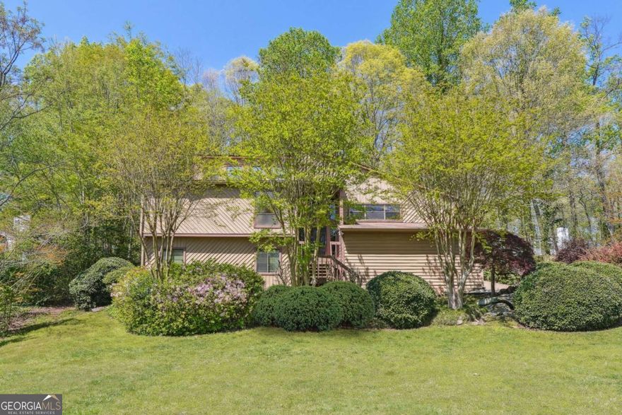 Step into the charm of this classic mid-century split-level home, perfectly situated in the well-established Willow Point neighborhood in East Cobb's Walton High School district. Featuring 3 bedrooms, 2 and a half bathrooms (the half bath has the potential to become a full bath) and over 1,900 square feet of versatile living space, this property is bursting with potential for those looking to restore or reimagine a timeless design. Original paneling, expansive windows and sliding doors, a statement fireplace, and clean architectural lines offer a solid foundation for your vision as evidenced in the photo renderings! The split-level layout provides functional separation of space, with a bright main living area, kitchen with a breakfast area, lower-level family and recreation room, and private upstairs bedrooms. Outside, a spacious backyard awaits your creative touchCoideal for outdoor entertaining, a garden retreat, or future expansion. Whether you're a renovator or a homeowner ready to add your personal touch, this is a rare opportunity to make this home your own in one of the best swim/tennis neighborhoods East Cobb has to offer. Don't miss the chance to unlock the potential of this unique home on a large lot!