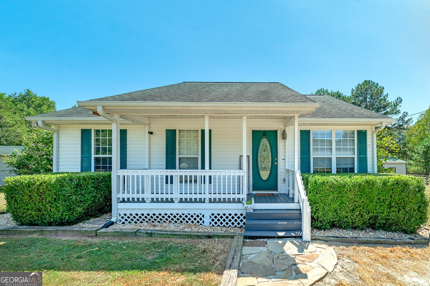 Enjoy Peaceful Country Living on 5.27 acres in Gay, GA! This 3 Bedroom/2 Bath home has smooth ceilings, LVP flooring, a rocking chair front porch and huge deck for entertaining or just watching your crops grow! There's plenty of room for goats, chickens, horses and any other farm animals, too! The HVAC was replaced in 2019; Roof replaced in 2017; newer 16x19 deck; three fully fenced pastures; power and water to 18x30 shop with lean to and 24x30 two stall barn with tack room; dual fuel back up propane heat; 180 ft drilled, filtered well and pump; fiber for internet/streaming at street and so much more! Quick access to Warm Springs, Senoia, and Peachtree City! See it today before it gets away!