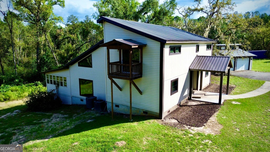 Photo of 38 Swann Lake Road, Hazlehurst, GA 31539 (MLS # 10870620)