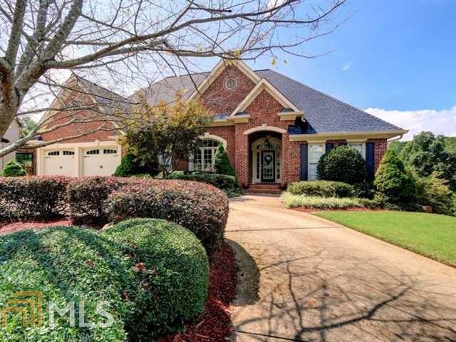 What a stunner! Looking for MASTER ON MAIN on the golf course? HERE IT IS! Exquisite home with double terrace levels has everything! Gleaming hardwood floors, formal living, dining, huge great room, breakfast area, fabulous kitchen. 4 seasons room is perfect for Georgia. Large multi level deck. Master is spacious, sitting area, bath with walk in tub, sep shower. 1st terrace has 3 bedrooms and potential 4th, 2 separate connecting baths. Level below has family room, plus 2 add'l bedrooms and full bath. Elevator shaft, private, perfect!
