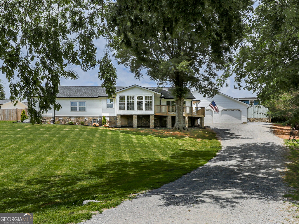 Sellers offering 10k toward buyers closing cost. This beautifully renovated home has been completely updated from top to bottom-no detail was overlooked. In addition to cosmetic upgrades, there is a new roof, septic system and field lines, all new plumbing, water heater, and electrical. Start your mornings on the charming front porch, taking in picturesque views of rolling hills and fishing pond, just outside your front door. In the evenings, relax in the refreshing inground pool or unwind beside the stone fireplace under the spacious covered patio. Need room for a large vehicle or recreational equipment? The attached two-car garage features impressive 15-foot ceilings, offering ample space for all your needs. Move-in ready and ideally situated in a peaceful country setting, yet just a short drive from shopping and amenities. Don't miss this exceptional opportunity-schedule your showing today!