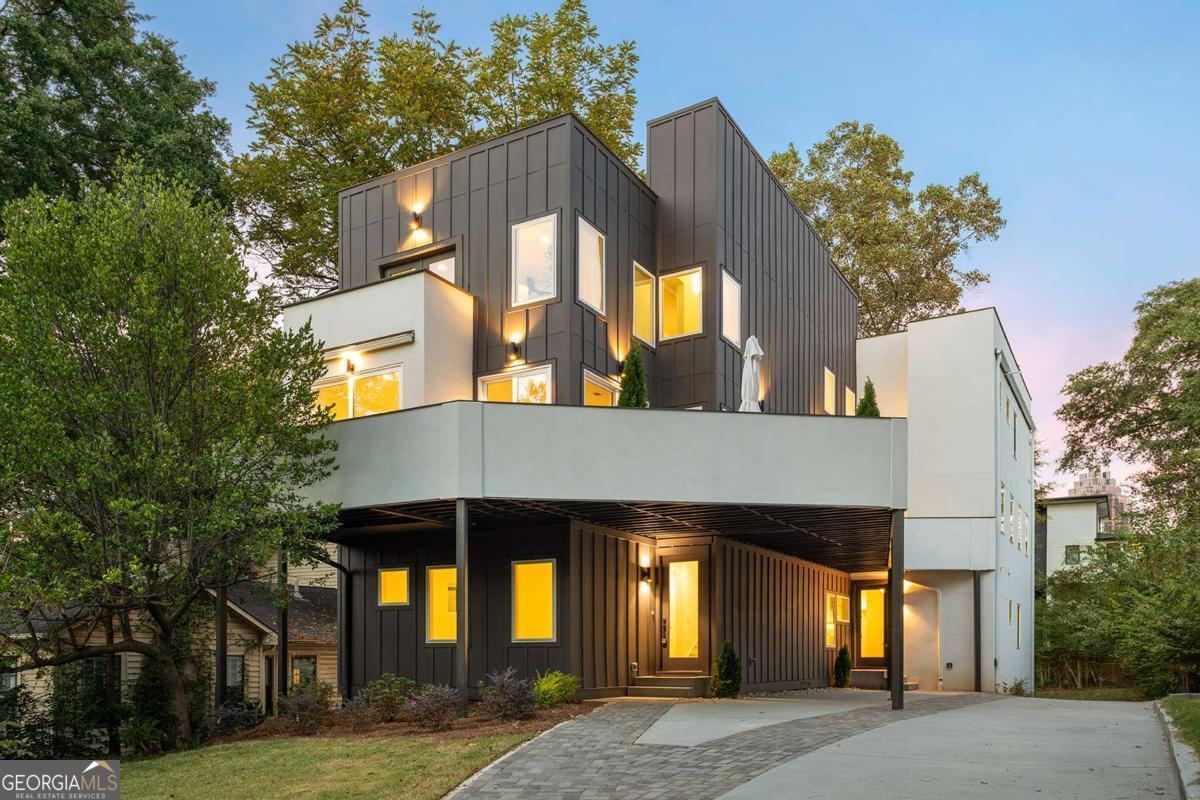 Discover unparalleled luxury and space in this brand-new, architecturally stunning townhome, perfectly positioned for ultimate city living near Georgia Tech and Atlantic Station in Home Park! There are 2 units but being sold separately as Unit A and Unit B. This home is Unit B, 3,987 sq ft of sophisticated living space with a private rooftop of about 1001 sq ft, and about 627 sq ft of decks and balconies - all with city views-a true entertainer's oasis. Unique to this unit, the kitchen and living areas open directly onto a dedicated main-level deck, perfect for grilling and easy entertaining. Comprising luxury finishes & spa-inspired design, the open-concept main level features a gourmet kitchen with Bosch stainless steel appliances, top of the line Cambria quartz countertops, and elegant gold fixtures throughout the home. Above it all, the dedicated upper floor primary suite serves as a private sanctuary with its own private balcony. An exclusive, unique bathroom featuring a luxurious soaking tub, Cambria quartz counters, an oversized shower with frameless glass on both sides, and bright skylights that fill the space with natural light. The lower terrace level offers massive flex space, easily adaptable for a gym, media room, or home office, with a full bathroom. Live in the epicenter of convenience, minutes from Georgia Tech, Atlantic Station, premium shopping, dining, and immediate access to I-85.