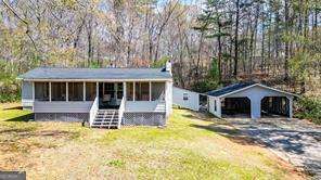 Charming single-story home on a private 1-acre lot in Canton! Featuring 3 bedrooms and 1 bathroom, an eat-in kitchen and a spacious screened-in front porch. A detached two bay carport provides ample space for parking and the breezeway leading to the covered back porch will keep you dry on rainy days! New Roof, and flooring!