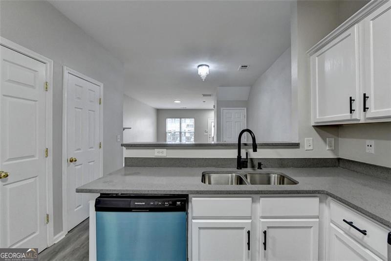 Newly updated townhouse. This beauty has been painted inside and outside. UPDATED bathrooms, vanity, Quartz counter top, light fixtures and new appliances. SECTION 8 OKAY Minutes from major highways , I-85, I-285, 78.