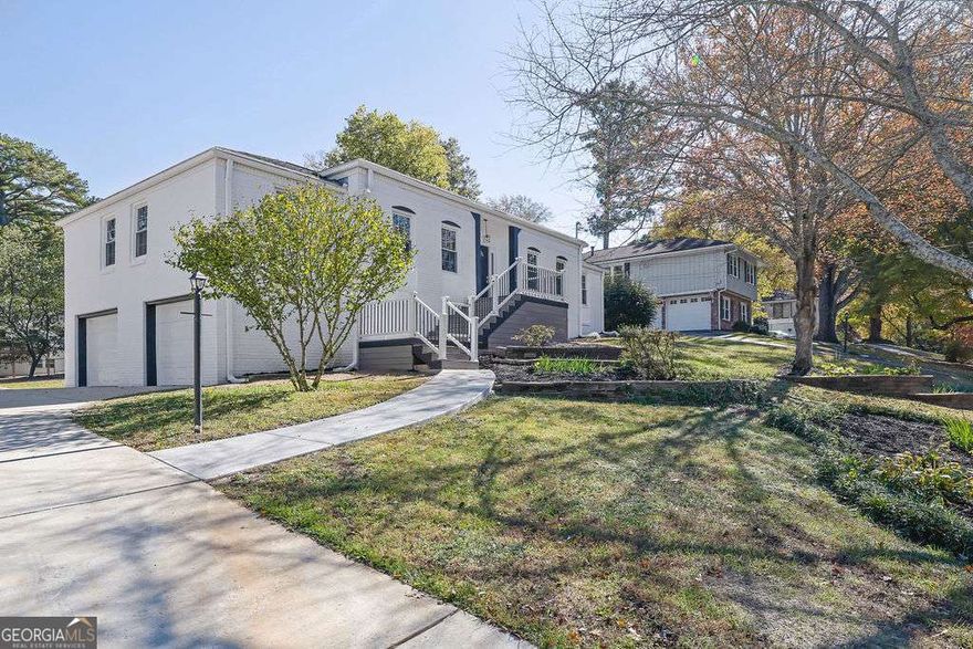 Welcome home to this beautiful COMPLETELY renovated 4 bedroom, 3 bath all brick charmer in highly desirable East Cobb! Almost literally everything has been replaced. Step inside to a spacious open floor plan filled with natural light, where the brand-new kitchen shines with new counters, a large island, sleek new appliances, custom cabinetry, all new hardware, and refinished hardwoods. All three bathrooms have been thoughtfully redesigned with stylish tile finishes, giving the home a modern, move-in-ready feel. Newly refinished basement offers a bedroom, kitchenette, full bath, and separate laundry room. Bring a family member or make extra income with a tenant! Outside, enjoy a beautiful backyard with plenty of deck space-perfect for gatherings, play, or simply relaxing. A rare find in this sought-after zip code!