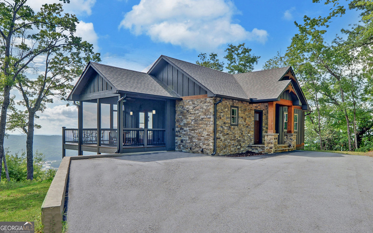 We welcome you to our beautiful 3 bedroom, 3.5 bath craftsman style mountain home in Rabun County, Ga. Enjoy one of the best views in Clayton at our just listed property in prestigious Black Rock Estates. This property is one mile from Main St. in Clayton--fun for all the shopping you may want to do in our unique shops and the first class restaurants with many serving farm to table. Clayton is the Farm to Table #1 City in Georgia! You can truly relax at the top of the mountain with views you thought were only in a book, listening to occasional wildlife as privacy, peace and quiet are your new best friends. Then, make a reservation at one of our fine restaurants and you and your family or friends can get ready for an unbelievable night in Clayton. It's the best of both worlds! You will love the privacy at the top of the mountain in your very own like new cabin built in 2023. As you enter the front door, you will immediately see the grand views from your living room, and then realize every area has beautiful views, no matter what window you are looking out of! The attention to detail is seen immediately with the vaulted ceiling and the exposed beams and tongue and groove. The hardwood floors on the Main level are beautiful. The handy door in the living room to the front deck is perfect when you are entertaining. Everything flows so well and is right at your fingertips! The colors in the cabin are tastefully done. The primary bedroom on the main floor is bright and cheery with a walk-in closet, a double vanity and large shower and, of course, beautiful views. The kitchen is the perfect size for entertaining while cooking at the same time. We all know where our guests and families always end up-the kitchen-and living room combo of kitchen and dining area and screened porch and deck are in a happy circle. The fireplace in the living room is perfect for those chilly evenings and watching the night view twinkle from the lights of the city. Downstairs, you have 2 bedrooms and two baths, a wet bar and the ability to walk out on your patio to the outside air--a perfect place for a hot tub and fire pit. The property is 3.00 acres, which includes some land on the other side of the road. This is an easy, enjoyable mountain home to own, close by Lake Burton, Lake Rabun and Seed Lake. Don't be spending your time cleaning and landscaping--Come to Rabun County and enjoy all we have to offer in outside activities! Make an appointment to see this home and open your eyes to the dream you have been having for years! It's right here waiting for you! The seller wants you know that his family bought this home primarily to celebrate Christmas in the mountains. His relatives from other states also come for the festivities. This year, they wanted to celebrate Christmas in July! Hope you enjoy our Christmas decorations as much as we have enjoyed this mountain home.