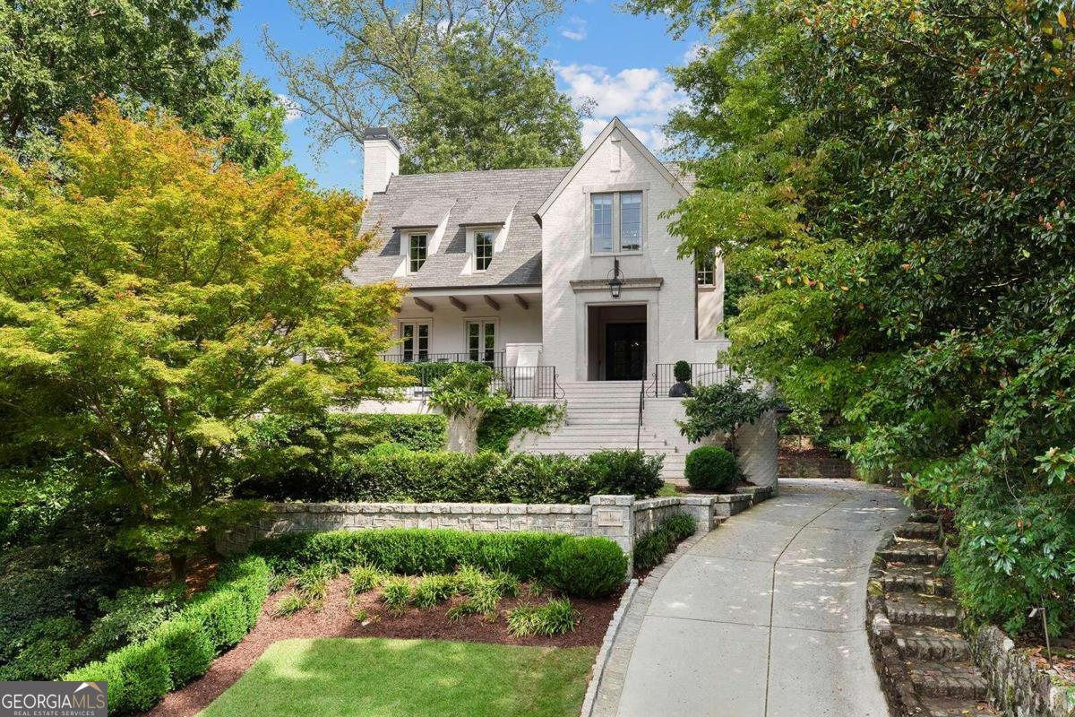 Exquisite Ansley Park home Overlooking Winn Park & Midtown Skyline. Welcome to this stunning custom-built residence, completed in 2018, nestled in the heart of historic Ansley Park. A rare find, this home is situated on a deep and coveted lot on one of Ansley's most quiet streets. The home features five bedrooms on the upper level, including an expansive primary suite offering the ultimate in comfort and privacy. With six bedrooms total, including one on the main level, this home is designed for both luxurious living and seamless entertaining. Impeccable craftsmanship is on display throughout, including a stunning waterfall edge island and barreled ceiling in the chef's kitchen which add architectural elegance. The kitchen boasts top-tier appliances and flows effortlessly into the family room and spacious loggia, complete with a wood-burning fireplace, perfect for year-round indoor-outdoor living. Step outside to the walk-out backyard, a secluded paradise featuring a beautifully designed pool, lush landscaping, and exquisite hardscaping. This tranquil, private setting provides a serene retreat from the bustle of city life, ideal for relaxation and entertaining. Additional features include a home gym, a cozy library, media/game room, additional office space and a 4-car garage. Enjoy al fresco dining on the inviting front porch, where you can take in breathtaking views of both Winn Park and the Midtown skyline. This space offers a perfect setting for outdoor gatherings, with seamless connectivity to the home's interior living and dining areas, ideal for entertaining. Located just two blocks from the newly reimagined Colony Square and Atlanta's vibrant cultural arts district, this home offers unparalleled access to the best of city living, while maintaining a tranquil, private setting. This is Ansley Park living at its finest.
