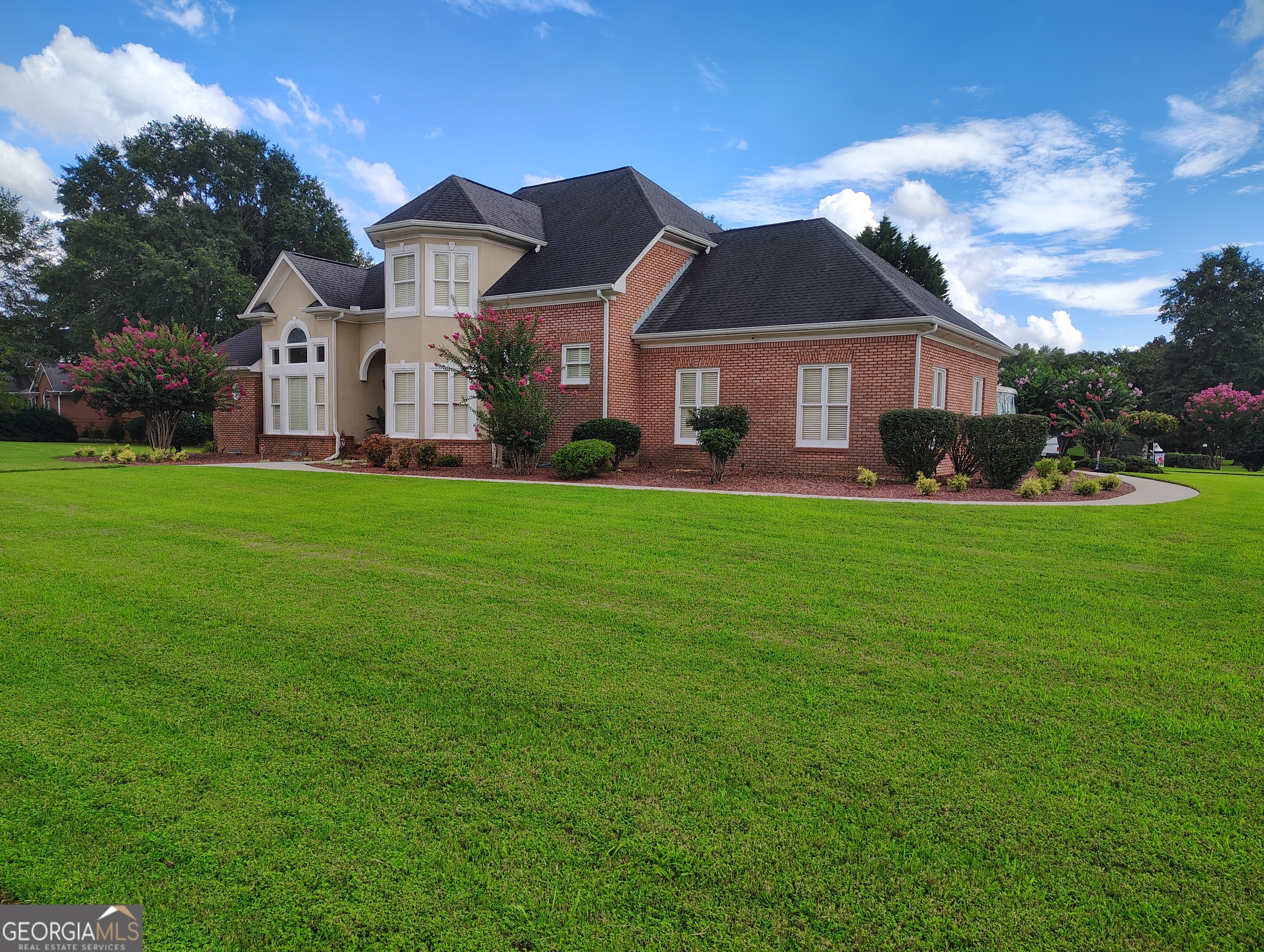 Elegant upscale home with soaring 14 foot and 12 foot ceilings. Beautiful Crown Moulding and finish work. This home has been meticulously maintained and is move in ready. Lots of natural light with custom windows, plantation shutters throughout. Large well-appointed Master Suite on the main level. 2nd Master suite on the 2nd floor. Excellent quality home in a well established subdivision in charming Oxford.