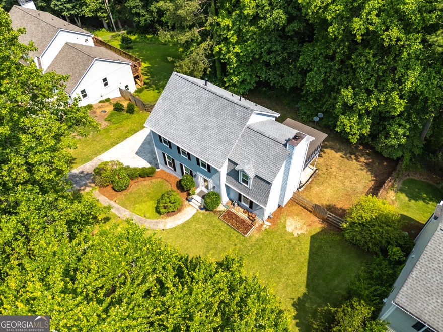 Welcome to this beautifully renovated traditional home, ideally located in the highly sought-after WALTON High School District and just minutes from everything you need. This 4-bedroom, 2.5-bath gem is nestled in a vibrant swim/tennis community and perfectly blends classic charm with modern upgrades.  The main level features rich hickory hardwood floors throughout, complemented by upgraded windows and doors that fill the home with natural light. The fully renovated kitchen boasts custom cabinetry and elegant quartz countertops-perfect for everyday living and entertaining. Retreat to the spa-like primary bathroom, complete with a newer oversized shower with pebble flooring, upgraded countertops, fixtures, and hardware. Both the half bath on the main level and the guest bath upstairs have been tastefully updated as well. Downstairs, a finished playroom offers a flexible space ideal for a game room, media area, or kids' hideaway. Step outside to enjoy a spacious screened porch overlooking a large, level, and fully fenced backyard-your private sanctuary for relaxation, family fun, or entertaining guests. Additional highlights include fresh interior paint and updates to the deck and sunroom. This home is move-in ready and ideal for families looking for quality living in East Cobb. Don't miss your chance-schedule a showing today!