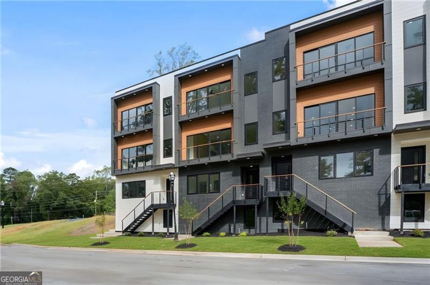 Claim the executive lifestyle you've earned at Grand Terraza-Decatur's premier new address for luxury townhome living.    Designed for the professional who demands excellence without compromise, these stunning new-construction townhomes offer an expansive 2,470+ sq. ft. across four thoughtfully designed levels. Whether you're hosting colleagues or simply unwinding after a demanding week, you'll appreciate the 4 bedrooms, each with its own private en-suite bath, ensuring supreme comfort for family and guests. The owner's suite serves as your private retreat, featuring custom built-in shelving and spa-inspired finishes that redefine luxury.    Inside, every detail speaks to a curated, high-end aesthetic: Luxury Premium Contemporary SPC flooring offers the rich look of hardwood with unmatched durability, complemented by quartz countertops, designer lighting, custom cabinetry, and premium appliances. Rare two-car garages plus driveway parking eliminate the urban parking headache, while private outdoor terraces and select finished basements provide ideal spaces for sophisticated entertaining or quiet contemplation.    Your time is valuable. Grand Terraza delivers an unparalleled location that makes your commute effortless: just 4 miles to Emory, 5 miles to the CDC, and 7 miles to Downtown Atlanta. With a nearby MARTA station, city access is seamless, allowing you to reclaim your evenings. This vibrant Decatur neighborhood puts you minutes from boutique restaurants, charming coffee shops, and cultural hot spots-all the amenities a cosmopolitan lifestyle requires.    Smart energy efficient construction and a builder's warranty offer confidence in every detail.  This isn't just a home; it's a strategic investment in your quality of life. Luxury. Convenience. Prestige. Secure your future at Grand Terraza, where modern sophistication meets effortless in-town living.