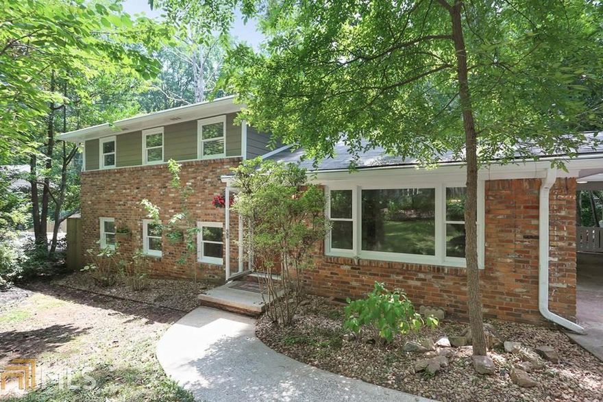Come experience the perfect combination in this MODERN WOODLAND RETREAT literally minutes to all the action of East Atlanta Village & downtown ATL. Every detail hand crafted in this East Atlanta gem.  Brand new hand stained concrete and hardwood floors, all windows updated. Whole house water filtration system, radiant heat tiled kitchen floor, custom made concrete counters. Huge screened in back porch, perfect for entertaining overlooks enormous backyard with stone firepit. THREE storage/workshop areas. Fresh paint inside and out, new roof, energy efficient spray foam insulation throughout. Large laundry room w/custom cabinetry.