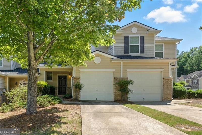 Looking for amazing value? This is it! This home has been recently upgraded with a new roof, new water heater, and 2023 heat pump replacement-meaning you can relax knowing the big-ticket items are already taken care of. Plus, the low HOA fee covers the building exterior (including the roof!), weekly trash service, termite coverage, and lawn maintenance. That's years of worry-free living with minimal upkeep. Step inside to a light-filled, open-concept main level with a spacious living room, dining area, and a kitchen loaded with cabinets and counterspace-perfect for everyday living and entertaining. A convenient half bath and secure one-car garage with opener complete the first floor. Upstairs, the large primary suite boasts a tiered ceiling, walk-in closet, and jetted soaking tub for the ultimate retreat. A generous secondary bedroom, oversized second bath, and laundry room round out the upper level. The community itself is a gem-offering a pool, basketball courts, a park, and a pavilion for gatherings. Sidewalks throughout make it easy to stroll, with plenty of extra parking for guests. For added peace of mind, Woodstock Police and Fire are located right at the community entrance. All of this in a prime location on Hwy 92 near I-75-just minutes from Downtown Acworth, Downtown Woodstock, KSU, and Red Top Mountain for hiking, camping, and boating adventures. To make a great home even better, take advantage of a 1/0 interest rate buydown at no cost to you OR a $500 lender credit toward closing costs-making homeownership more affordable from day one! This townhome checks every box: value, updates, location, and lifestyle. Don't miss it!