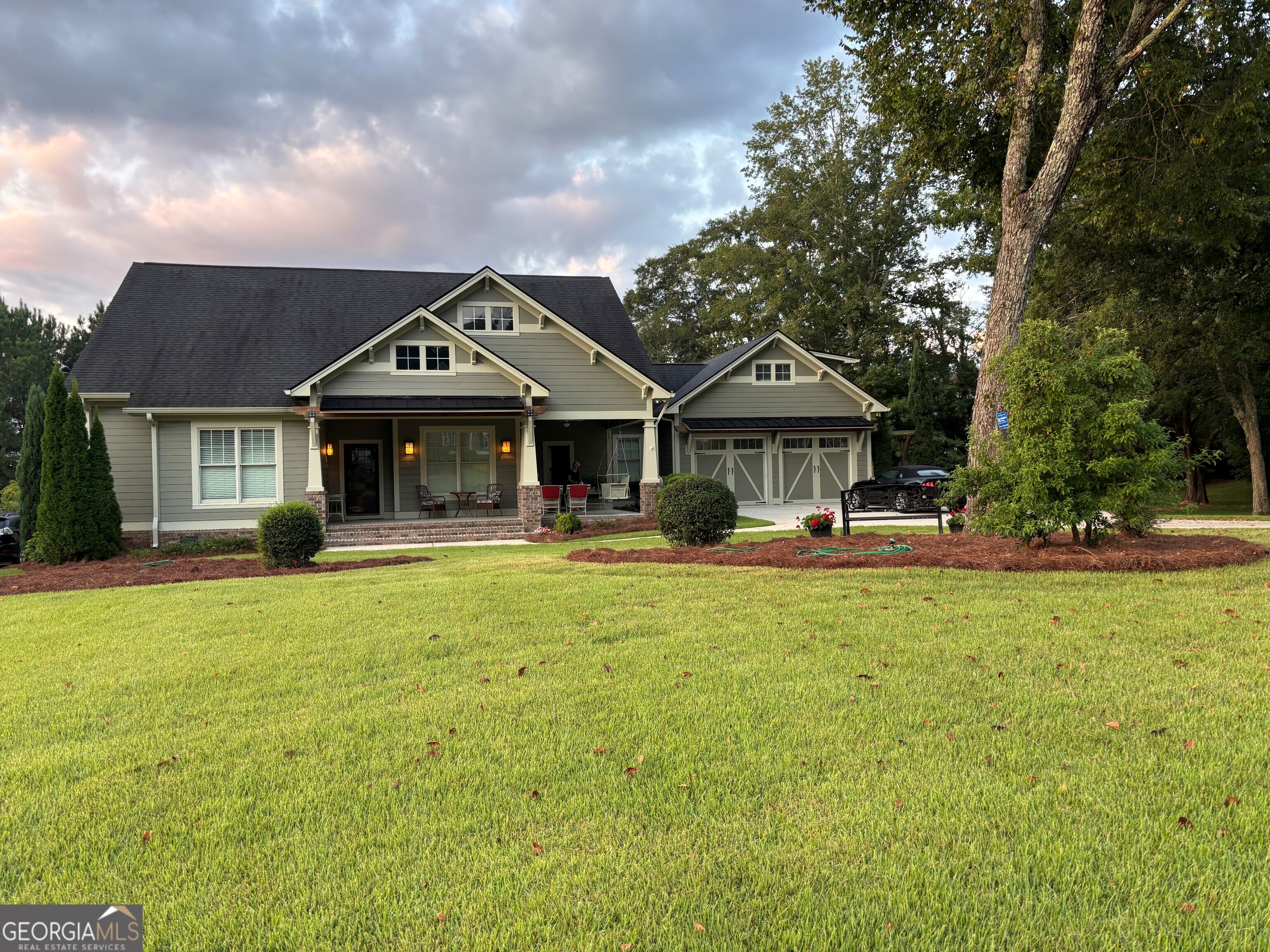 Custom built craftsman home includes two lots with lighted trees, invisible fence for pets. Great room has 12 ft. coffered ceiling. All other ceilings are 10 ft. Large front porch plus a screened 12x17 ft. back porch. If you like a craftsman style, you'll like it!!