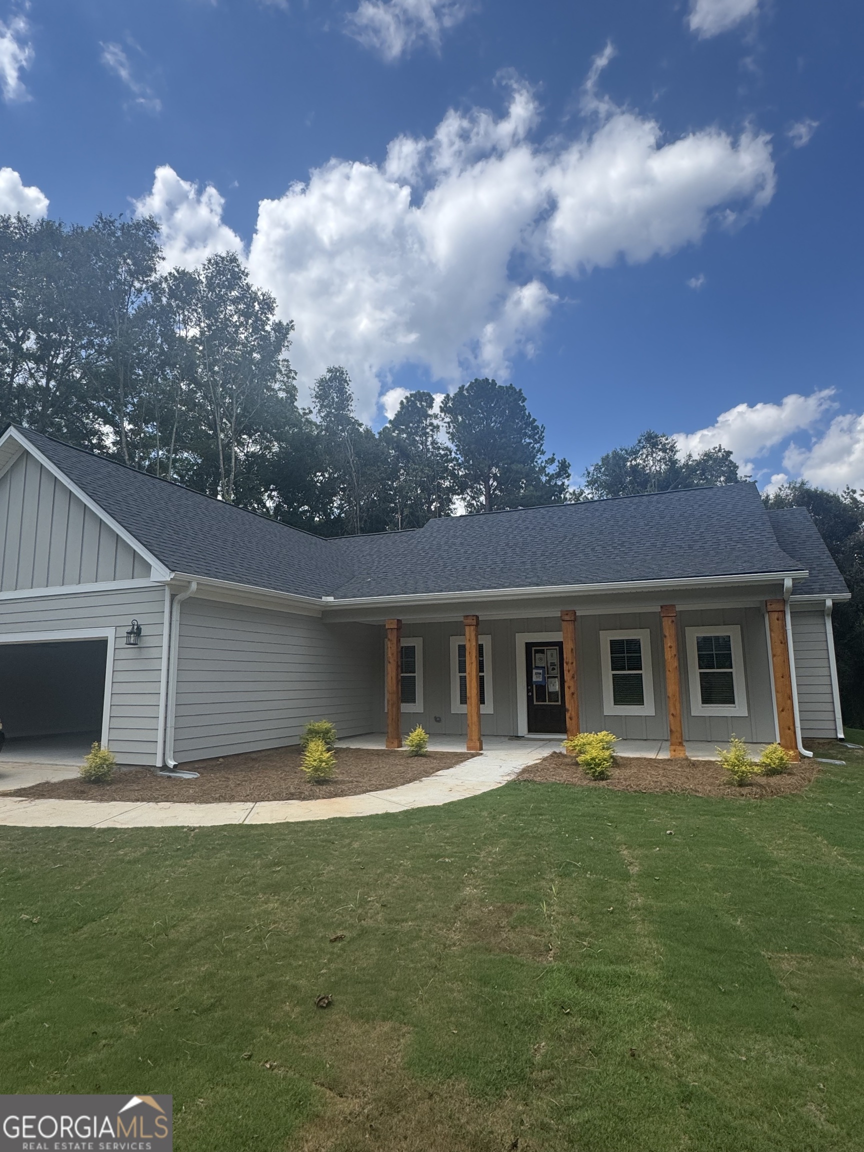 Chisel Mill Homes is offers the beautiful Bradford plan, a beautiful 4BR/2BA ranch on quiet Cross Plains Road in Carrollton, GA. This 1,800 sq ft Ranch home features modern finishes, durable Hardie board siding, and a 2-car garage. Open-concept layout with stainless steel appliances, spacious kitchen, and natural light throughout plus serene fireplace to accent the open, yet cozy Family Room. Owner's suite on main features spacious design complete with large Master bathroom with tiled floors, garden tub and seperate walk-in shower. Situated on a private lot just under 5 acres-plenty of space to relax, garden, or explore. A perfect blend of comfort, style, and privacy! *Interior photos are stock from previous plan build*