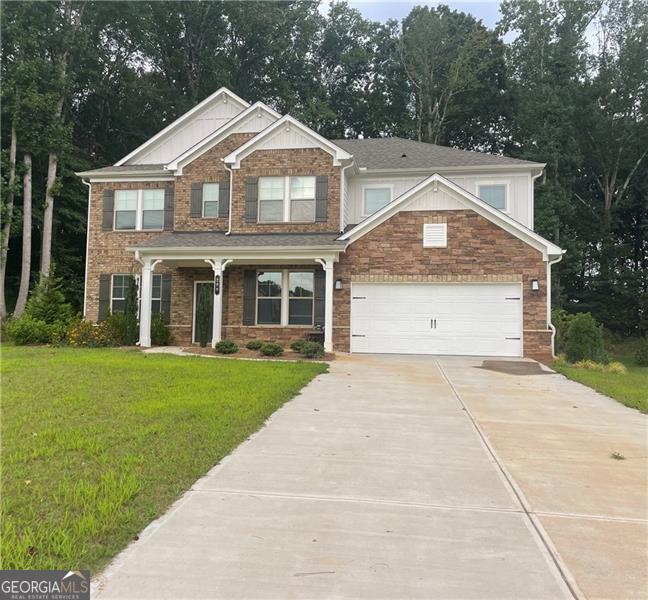 Welcome to this meticulously maintained, move-in-ready home built in 2023, located in one of Canton's premier golf, swim, and tennis communities. Designed with versatility and style in mind, the sought-after Easton plan features an open-concept layout with a spacious main-level guest suite complete with a walk-in shower and generous closet. The gourmet kitchen boasts quartz countertops, soft-close cabinets, stainless steel appliances, a butler's pantry, and modern light fixtures, flowing seamlessly into a two-story gathering room with a cozy fireplace and a formal dining room perfect for entertaining. Additional spaces include a flex room ideal for a study or hobby room and a luxurious upstairs owner's suite with an oversized walk-in closet and expansive shower, along with four more bedrooms and a second laundry room. Design upgrades include luxury vinyl plank flooring on the main level, oak tread stairs, open railings, and double doors to the study. Situated on a quiet cul-de-sac lot with a tree-lined backyard, a covered outdoor living area, and a long, flat driveway, this home offers both elegance and convenience, with structural enhancements like a large owner's shower and added gas line completing the package.
