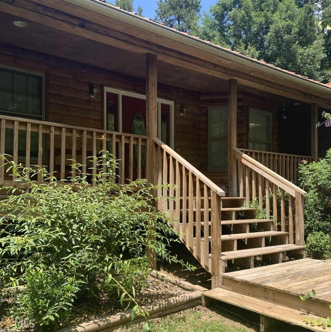 Peace and tranquility at it's best with this 4BR/2BA ranch style home on 6 private acres. From the winding private drive to the secluded lot and covered front porch, you'll fee right at home. Boasting hardwood floors throughout with soaring vaulted ceilings, stone fireplace, separate dining room, over-sized bedrooms, huge deck for entertaining, and a basement ready for expansion, this one will continue to meet your needs. The master suite features access to back deck along with tiled bath to include a walk-in closet, double vanity, jetted tub, and separate shower. You don't want to miss out on this hidden gem!