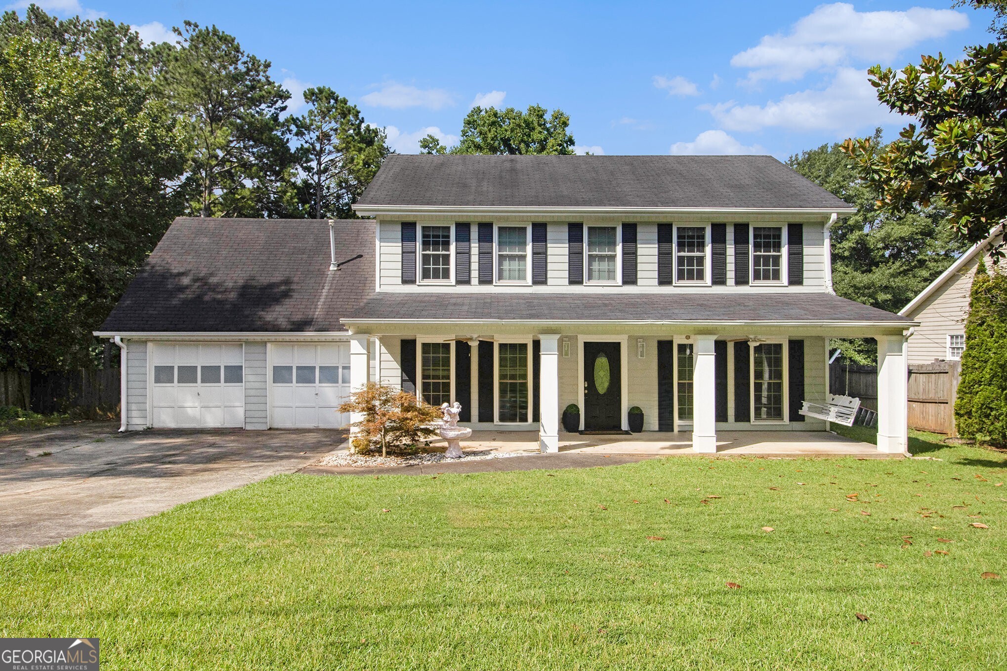 Charming Colonial-Style Home in Sought-After East Cobb! Tucked away on a peaceful, tree-lined street in the sought-after Kell School District, this move-in ready gem blends classic architecture with modern updates in an incredibly convenient East Cobb location. Situated in Lakewood Colony and just minutes from Highway 92, I-75, Downtown Woodstock, Shopping, and Dining - the location simply can't be beat. Inside, enjoy classic details like Crown Molding, Tall Ceilings, and an Abundance of Natural Light. The Fireside Family Room features Custom Built-Ins and Ample Storage, while the Spacious Dining Room flows seamlessly into an Updated Kitchen complete with Custom Stone Counters, Stylish White Cabinets, a Chic Backsplash, and Stainless Steel Appliances. A Dedicated Office Space and convenient Half Bathroom complete the Main Level. Upstairs, the Primary Bedroom retreat offers a Walk-In Closet and a Beautifully Renovated Ensuite Bathroom with a Stone Vanity, Oversized Soaking Tub, and a Frameless Glass Stone Shower. Three Additional Bedrooms share a Well-Appointed Hall Bathroom. Step outside to a Screened-In Porch that's an entertainer's dream, featuring a Built-In Bar Area perfect for hosting. The Fully Fenced, Flat Backyard offers Endless Possibilities for Play, Gatherings, or Relaxing Evenings Around the Fire Pit. Lakewood Colony offers a peaceful, amenity-rich lifestyle with a Neighborhood Pool and Easy Access to Top-Rated Cobb Schools, Parks, Shopping, Dining, and More. With so much to offer inside and out, this home is the one you've been waiting for!