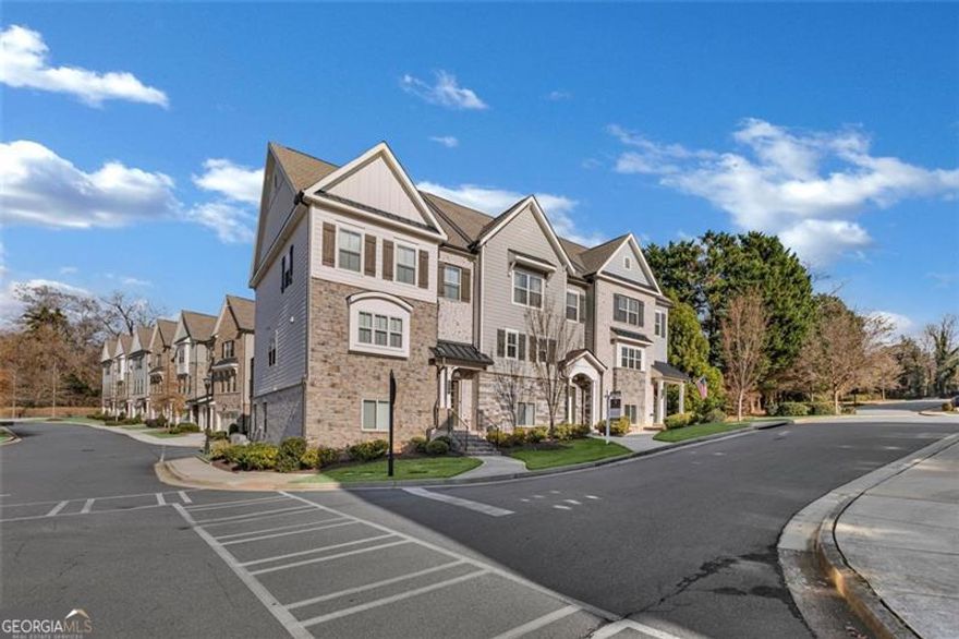 Stylish 3-Level Townhome Near Marietta Square  Welcome to this beautiful 3-level townhome located in walking distance from Marietta Square in sought-after Cobb County! This home offers a spacious and open floor plan on the main level, the kitchen offers impressive counter space and cabinet design perfect for entertaining and everyday living.  Enjoy the expansive deck off the main level, great for relaxing or hosting gatherings and take advantage of the rear-entry garage for convenient parking and additional storage. Light color walls & cabinets photos were added to show potential look for those that would like a different look, also the seller had a contractor quote $8200 to paint the entire interior a light color and cabinets/vanities white.  The prime location gives you quick access to the vibrant shops, dining, and events of Marietta Square, along with excellent local amenities and transportation options.  Don't miss out on this fantastic opportunity to experience comfort and convenience in a thriving neighborhood!