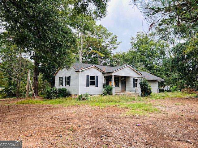 Classic 1955 ranch sits on a level 1.09-acre lot in the heart of Cobb County with excellent fix and flip potential. Large and level lot with all utilities and sewer beside is zoned R-20 and has potential for 2 new homes with 20,000 + square foot lots. Amazing central location only 4 miles to Interstate 75 and great county road access to Marietta, Woodstock, Roswell and beyond could be an ideal property for commercial rezoning to locate your business. Just 1 block off Canton Road/ Highway 5 with 30,000 cars-per-day ADT. New roof in 2023, some new windows, and some new sheetrock and wiring replaced recently. Come explore the many opportunities that await!