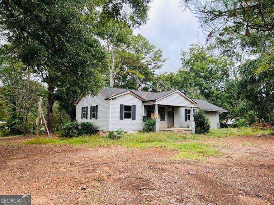 Classic 1955 ranch sits on a level 1.09-acre lot in the heart of Cobb County with excellent fix and flip potential. Large and level lot with all utilities and sewer beside is zoned R-20 and has potential for 2 new homes with 20,000 + square foot lots. Amazing central location only 4 miles to Interstate 75 and great county road access to Marietta, Woodstock, Roswell and beyond could be an ideal property for commercial rezoning to locate your business.  Just 1 block off Canton Road/ Highway 5 with 30,000 cars-per-day ADT.  New roof in 2023, some new windows, and some new sheetrock and wiring replaced recently. Come explore the many opportunities that await!