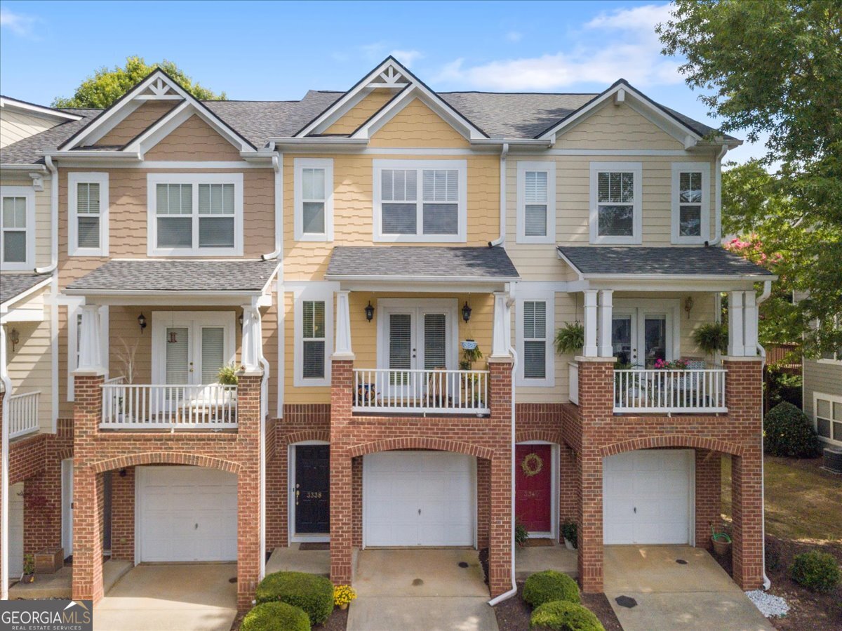 Wow, a beautiful listing in the Milton/Alpharetta, Georgia region. Enjoy this amazing townhome in the Alpharetta community. A home completely renovated from the roof to the AC, from the hardwood floors (vinyl) to the quartz counter top and new backsplash in the kitchen. From the Kohler kitchen faucet to all three bathrooms renovated with stunnng lighting throughout the house makes this home the townhouse of choice. The main area of this home features an eat-in-kitchen area, a kitchen bar, and a living room with a fireplace. Even the lighting and ceiling fans in this home have been perfectly designed. Next, the cabinets and floors are renovated. The quartz counter top and new backsplash makes this contemporary living most enjoyable. The stunning double sink will have you enjoy cooking and entertaining even as you sit on your kitchen balcony treasuring the view of the beautiful trees, or sitting on your deck off the living room. Also, the guest powder-room on the main floor is completely renovated from a new toilet to the cabinet and new lightening. The upstairs two bedrooms have new flooring and the bathrooms completely renovated. The downstairs extra room/bedroom is perfect for a bedroom, office or exercise room as it leads out doors for entertaining or a sweet BBQ. The Cambridge High School District in the well sought-after Wyndham community is just minutes from shopping, dining and the Windward Parkway, Halcyon, and the Big Creek Greenway. The one-car garage provides new lighting, additional storage and more parking is available as part of the Wyndham amenities which also includes swimming, and a playground area to walk your pet. Once you live in this community you will not want to leave.
