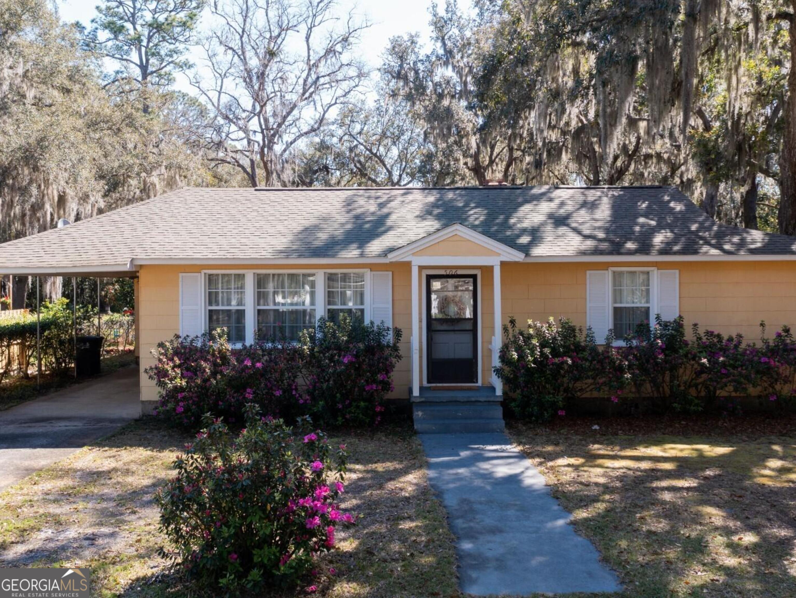 Great home in the heart of downtown St. Marys. Blocks to the St. Marys waterfront, shopping and restaurants. This home has had only one owner, 3 bedrooms 2 and one-half baths, 1862 sf,(per public records). Backyard is fenced with a huge garage/workshop with water available and 220V electric. Enclosed RV parking attached to the workshop. There is a sprinkler system with a shallow well on the property. Additional carport and garage parking attached to home. Short walk or golf cart ride, only blocks to downtown waterfront. Two public boat ramps within 3 blocks of property. Great location if you're working in Jacksonville or Brunswick, only 2 miles to Kings Bay. So many great memories made in this home, it's time for new owners to make their own.