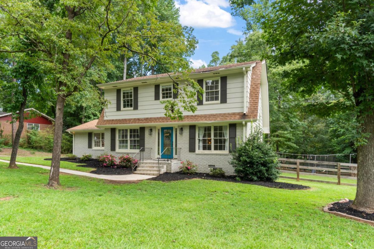 This delightful 4-bedroom, 2.5-bath residence perfectly situated in the vibrant heart of Sugar Hill. From the moment you step inside, you'll be greeted by a warm, inviting atmosphere that instantly feels like home. The main level features beautiful hardwood floors, adding timeless style and easy maintenance throughout the living spaces. The updated kitchen showcases granite countertops, new appliances, ample cabinetry, and generous counter space-ideal for both everyday living and hosting gatherings. The spacious living area offers a cozy fireplace, creating the perfect setting for relaxing evenings. Step outside to discover a large, fenced backyard complete with an expansive deck-perfect for outdoor dining, entertaining, or simply enjoying your morning coffee in privacy. Located within walking distance of the exciting downtown Sugar Hill area, you'll have easy access to local restaurants, shops, entertainment, and community events. With no HOA, you'll enjoy flexibility and freedom while still being close to everything this desirable area offers. Don't miss this opportunity to own a freshly renovated and move-in ready home in one of Sugar Hill's most convenient locations!