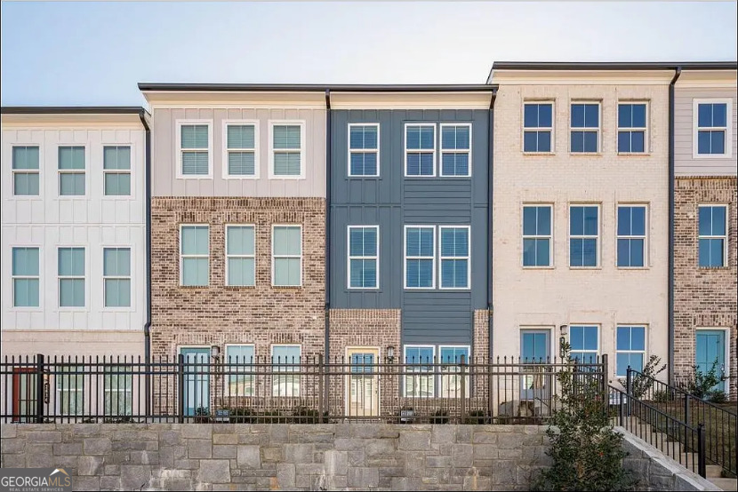 LIKE NEW! Breathtaking 3 story 2 bedroom, 2 full bathrooms and 2 half bath home is located in Atlanta's newest gated townhome community, Westside Bend! The open floor plan features large rooms, a gourmet kitchen with quartz countertops, tile backsplash, a 12' island and stainless steel appliances. The master bedroom walk in closet and tons of natural light! The entry level floor features a 2 car garage, a flex space and a full bathroom! Enjoy this eat, play, live lifestyle community that offers a pool, cabana, fire pit, and pet stations. Located near shopping, restaurants, the Beltline, all major highways (285, I20, 75 and 85) and more! Accessible to several major employment corridors including Buckhead, Midtown, Downtown, and Perimeter Center. Easy access to Vinings, Cobb Galleria, and Truist Park. Nearby access to the Proctor Creek Greenway trail and multiple green space developments including the Silver Comet Trail, Westside Park, Piedmont Park, and the BeltLine Trail. Spend weekends enjoying area attractions including the Fox Theater, Georgia Aquarium, Mercedes-Benz Stadium, Top Golf, and popular breweries and restaurants. Enjoy outdoor activities and recreation at Westside Reservoir Park, Bellwood Quarry, Cross Creek Golf Club. Truly a must see! Listing TypeTownhouse