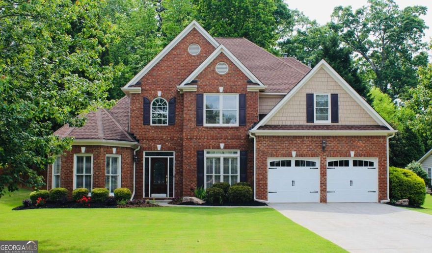 Welcome to 2940 Saddlebrook Glen Drive -- a beautifully updated four-bedroom, three-and-a-half-bath home nestled in the sought-after Saddlebrook Glen neighborhood and zoned for award winning, top-rated Forsyth County schools, including Big Creek Elementary, Piney Grove Middle, and Denmark High School.    This east-facing home welcomes you each morning with sunrise light streaming through the gorgeous updated front door. Inside, enjoy the ease of master-on-main living, featuring an oversized primary suite with a sitting area, his-and-hers walk-in closets, and a fully renovated spa-like bathroom with quartz countertops and updated fixtures. The entire main level boasts brand new flooring, plantation shutters throughout, and fresh interior paint, enhancing its open and airy feel.  The heart of the home is an open-concept kitchen and two-story family room. The kitchen features stainless steel appliances, updated countertops, a large walk-in pantry, and a butler's pantry conveniently connected to the formal dining room. A sunroom at the back of the house offers additional natural light and access to a fenced backyard. Upstairs, you'll find two bedrooms with a Jack-and-Jill bath, an additional bedroom with its own private full bath, and a bonus room ideal for a home office, kids' playroom, or media space. All upstairs bathrooms feature new countertops and updated fixtures. The home is situated on a large cul-de-sac lot and includes a climate-controlled garage, providing flexible space for a workshop, gym, or studio. Additional upgrades include updated lighting and hardware throughout, fresh exterior paint, an updated garage door, and a sprinkler system.    Enjoy resort-style amenities in the community, including a junior Olympic-sized swimming pool, tennis and pickleball courts, a playground, and direct access to Caney Creek Preserve. Located just minutes from shopping and dining at Halcyon, Avalon, The Collection and Trader Joe's. Also enjoy the convenience of being close to the Big Creek Greenway, Lake Lanier, and the North Georgia Premium Outlets. The North GA mountains and the airport are just a 45 minute drive away. This location combines serene neighborhood living with unbeatable convenience.   Don't miss this move-in-ready gem in one of Forsyth County's most desirable communities!