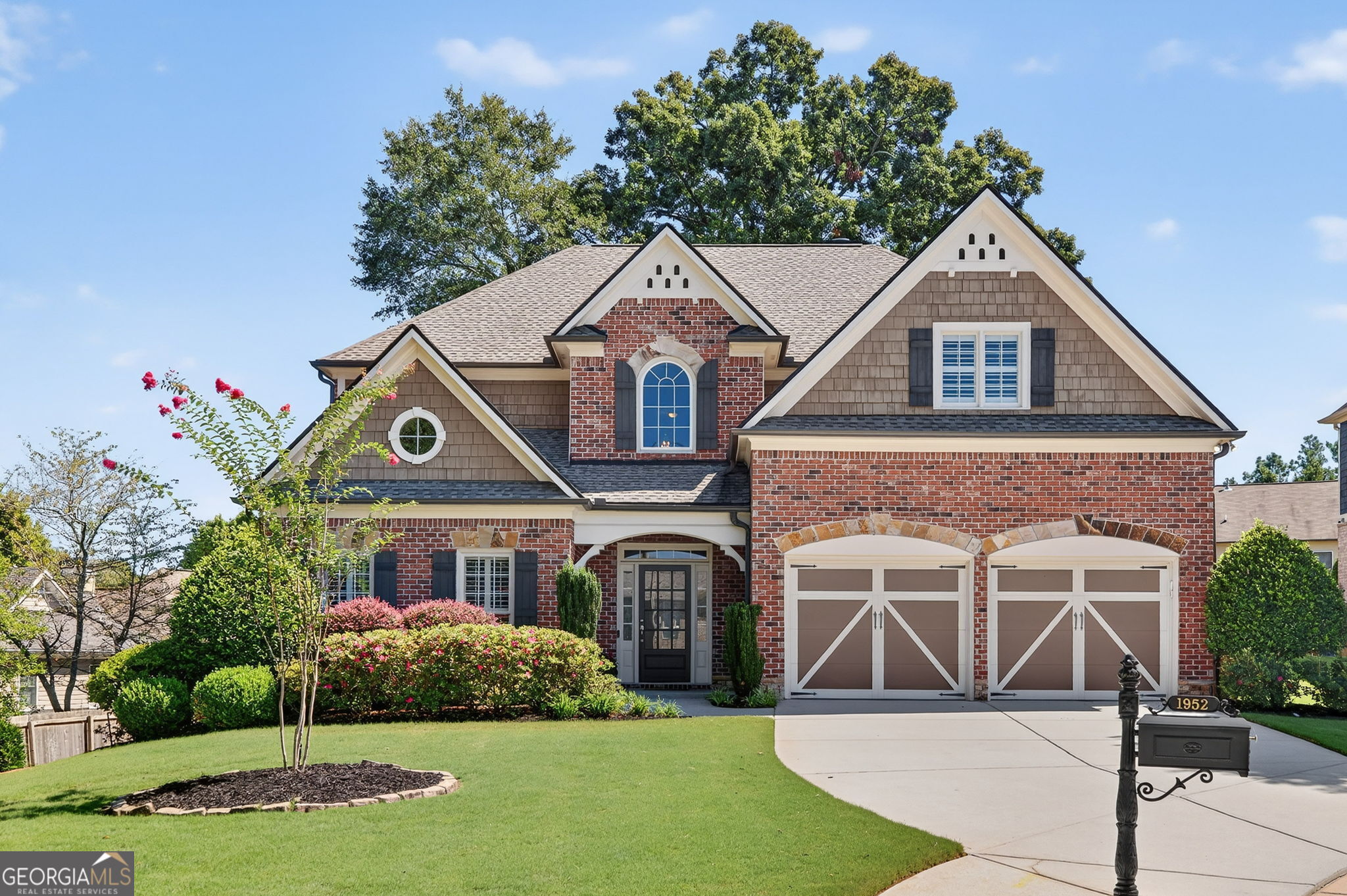 Gorgeous move-in ready brick home on cul-de-sac lot in desirable Smyrna location! Bright and open floor plan featuring a separate living room, dining room, and a beautiful chef's kitchen with stainless appliances, loads of cabinet space, and kitchen island overlooking the large fireside great room. Custom slate patio off of kitchen featuring a private manicured backyard perfect for grilling out and entertaining friends and family! Additional features on main include bedroom with full bathroom, laundry room, and hardwood floors throughout. Wonderful primary suite upstairs including separate sitting area, two walk-in closets, and ensuite bath with soaking tub, double vanities and separate shower. Two additional bedrooms up with a jack and jill bath and a large bonus room perfect for a rec room, home theater, or office. Loads of upgrades including 3 year old roof, new HVAC, slate patio, landscaping, fencing and so much more! Fantastic location minutes to The Battery, Smyrna Market Village, restaurants, shopping and so much more!