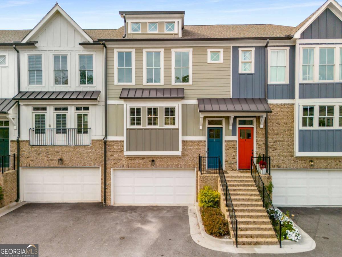 You have not seen a luxury townhome quite like this one before! This recently built townhome combines an unbeatable floor plan with custom finishes and details not found in other cookie cutter townhomes! Prepare to wow your guests with an entertainer's kitchen that you'd find in homes at twice the price! A charming and welcoming front elevation greets your guests. The custom kitchen showcases quartz counters, stainless appliances, an enormous island and an abundance of storage! The kitchen overlooks the dining room & living room warmed by gas fireplace. A powder room on main is ideal for entertaining. Custom light fixtures and rich hardwood oak floors run throughout the ENTIRE home! No carpet here! Upstairs 3 full bedrooms and two baths include a spacious primary suite with separate his & her walk in closets, and a spa bath with double vanities and a walk in shower with a frameless glass surround. The lower level boasts an enormous flex space that can serve as in-law suite; 4th bedroom; rec room or office with a full bath. This exceptional townhome is Nestled in the HEART of HISTORIC NORCROSS, just steps from shopping, dining, Thrasher Park, Lillian Webb Park, Rossie Brundage Park, and the new K-5 State Charter School (Brookhaven Innovation Academy). The community amenities include a gated pool and a fire pit to enjoy those cool fall nights. EZ access to Peachtree Industrial, I85, I285 and Marta for EZ commuting. Plus you are just minutes to the Nationally-Ranked NORCROSS STEM HS and many private schools such as GACS, and Wesleyan. Enjoy free City Summer Concerts and seasonal festivals steps from your front door. Also conveniently located near Technology Park, Assembly Movie Studios, Shoppes at The Forum, Peachtree Corners Town Center, West Gwinnett Aquatic Center, Pinckneyville Baseball and Soccer Parks and more. Call to schedule your appointment today, this home is a must see!