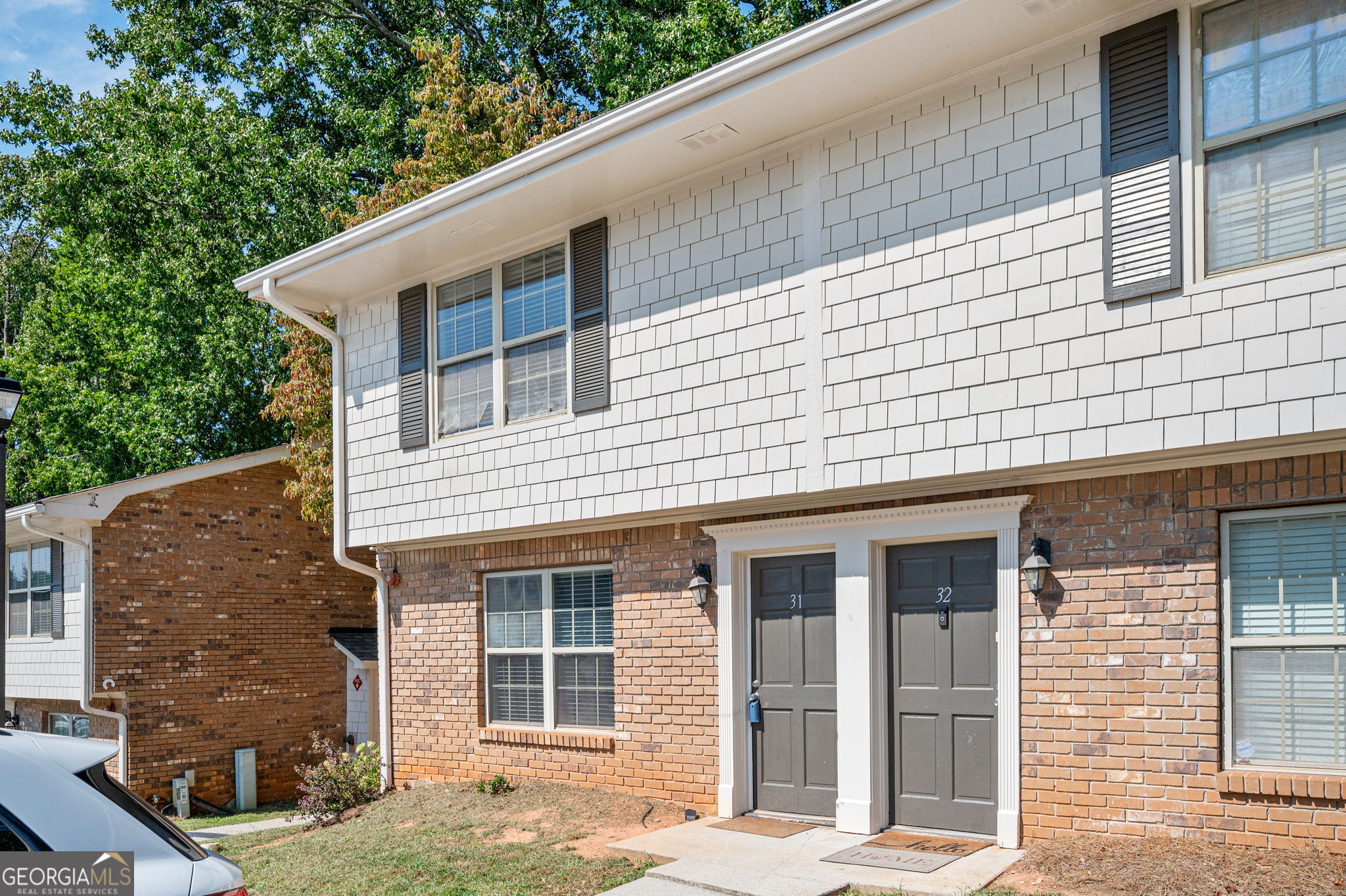 Recently painted and move-in ready, this end-unit Smyrna townhome offers 2 bedrooms, 2.5 baths, a smart split-bedroom layout with private suites, and bathrooms upgraded with granite countertops. The main level features durable LVP flooring, open living and dining spaces, and a light-colored kitchen with stainless steel appliances and granite counters. A private back patio, two assigned parking spaces, and community pool add convenience, while the HOA covers exterior maintenance, water, sewer, and termite service-keeping expenses low. Walkable to Campbell Middle School and close to the Smyrna Community Center, shopping, Taylor-Brawner Park, Truist Park, and major highways. Priced to sell below similar units in the area, this home offers outstanding value-an excellent investment with no rental restrictions and strong demand, yet equally ideal for an owner-occupant seeking low-maintenance living with convenient access to Atlanta.