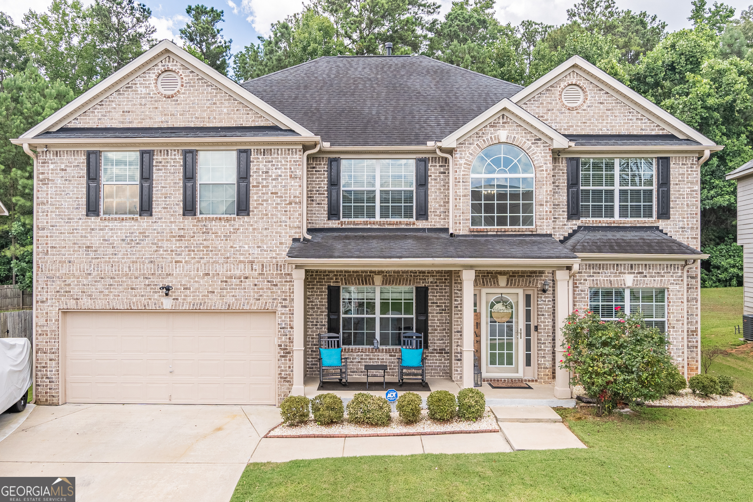Welcome to this stunning 5 bedroom, 4.5 bath two-story home nestled in a beautiful subdivision in South Fulton. Step into the grand two story foyer that sets the tone for spacious and elegant living. The main level offers a convenient guest bedroom, a full bath and an additional half bath for entertaining. The main level also boasts a large family room, dining room, and flex room. Upstairs, you'll find four generously sized bedrooms including a luxurious primary suite complete with a large sitting room a spa-like tiled shower, a soaker tub and a large walk-in closet. The kitchen boasts a large island, granite counter tops, inset sink and gas range. It is open concept living at its best. The backyard is perfect for gatherings. There is a large raised, covered deck with great ceiling fans and an additional patio. This home combines comfort, space, and a great community in one perfect package. The community includes great amenities. There is a pool, tennis courts, playground, sidewalks and street lights. Don't let this home slip past you! Call today for a tour!