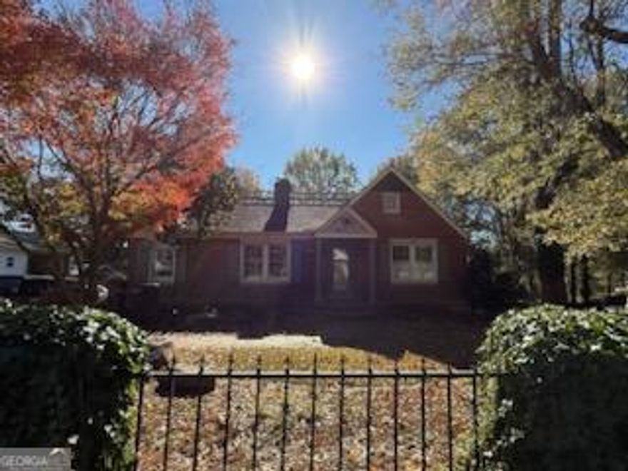 Welcome home to this charming 1950's in-town 4-sided brick ranch! It features all the original features such as hardwood floors through out, crystal door knobs and stately heavy trim through out this beautiful home. 3 bedroom, 3.5 bath - Family room with hardwoods and gas log fireplace, Formal dining, Library that could be used as 4th bedroom, oversized expanded Master on main with hardwoods, arch ceiling and his/her closets, Country kitchen features tile floors & loads of cabinet space. Guest bedroom on main with ensuite bath. Upstairs features oversized bedroom, walk-in closet and large bath with walk-in tile shower. Full finished basement with 1/2 bath and unfinished storage space. Covered back screened porch on upper level and covered porch on terrace level.  1-car detached garage or workshop with electricity and attached carport. Home sets on over a 1/2 acre in the city. Plenty of room for garden, or another structure. Plenty of parking with circular drive. Home is on a corner lot with 2- entrances. Such a lovely city home. Easy to show!!  Call for your private showing.
