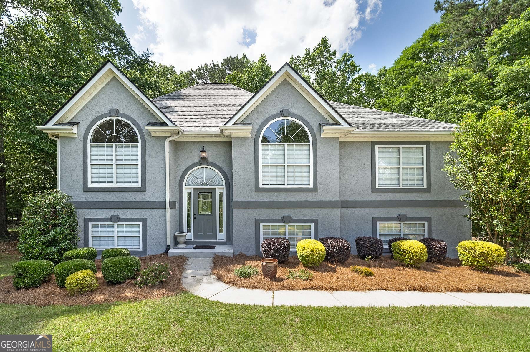 Freshly updated, thoughtfully designed, and ready for its next chapter! Welcome to this spacious 6-bedroom, 3-bathroom home tucked into a quiet, established neighborhood in sought-after Henry County. With a fresh exterior and interior, a newer roof from 2020, and a brand-new water heater, this home is move-in ready for your biggest plans and brightest dreams. Step inside and discover a flexible split-level layout offering room to live, work, create, and gather. The main floor flows easily with generous living spaces, a bright kitchen, and large bedrooms filled with natural light. Downstairs, the fully finished lower level-with its own private entrance-opens the door to endless possibilities: a guest retreat, hobby zone, home office hub, or anything you need to grow into your next season. Sitting on approximately one acre with a sloped, private lot, there's plenty of outdoor space to enjoy quiet mornings, weekend projects, or evening get-togethers. The setting offers the perfect balance of privacy, possibility, and connection to the community around you. Located in the highly regarded Ola school district and convenient to dining, shopping, and parks, this home blends everyday comfort with room to dream big. Modern updates, flexible space, and a setting that feels like home - and it's almost ready for you. More photos and full interior details coming soon!