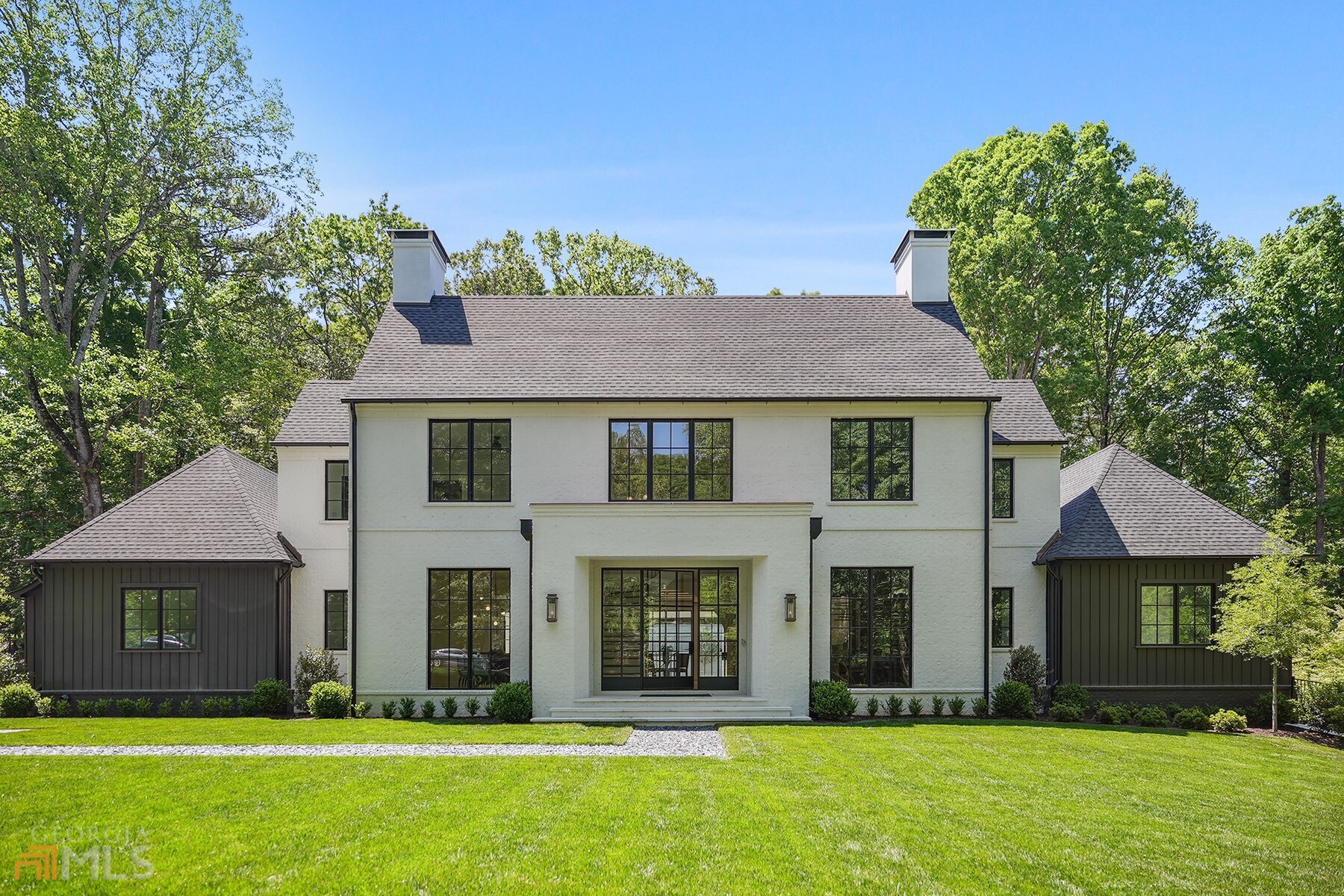 This beautiful new construction has it all! Amazing architecture by Castro Design, built by Derazi Homes, one of Atlanta's premier custom home builders, in a sought-after location in Buckhead. The main floor features a large open floor plan with a grand foyer, formal dining room, and study. The stunning kitchen with a large marble center island, custom cabinetry, and Wolf range overlooks the fireside family room with large iron doors opening to the covered patio. Gorgeous flat walkout backyard and a pristine pool with good size play yard. The main floor also features an owner's suite with large his and her closets, a secondary office space, laundry room, and mudroom off the three-car garage. Four bedrooms with en suite bathrooms and flex/play space are upstairs with additional laundry. The lower level is partially finished and has potential for one bedroom, 1.5 bathrooms, movie theater, wine cellar, and playroom/gym area. Short distance to Jackson Elementary School and minutes to Chastain Park. Amazing finish level inside the home with Arteriors lighting, Emtek hardware, all marble countertops and tile in every bathroom from Ciot. A must see. Move in Ready.