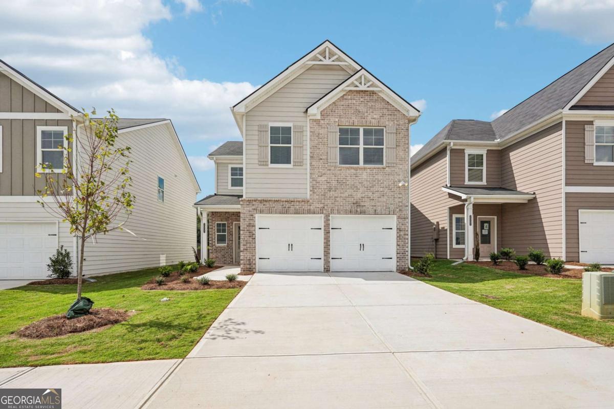 Welcome to the Westfield plan in Fairview Lake, a perfect blend of space and style with unlimited decor opportunities! Energy efficient LED lighting throughout! The foyer entrance leads to a spacious family room setting with an electric fireplace that give great aesthetic, along with coziness and comfort. A modern galley style kitchen offers inviting light, a breakfast eating area, an extended island bar with under-mount stainless steel sink, granite countertops, stainless steel appliances, pantry and plenty of cabinet space. An adjacent formal dining room is great for hosting special occasions, and creating lasting memories. The upper level has a generous loft space, great for gatherings and entertaining. Over-sized secondary bedrooms with walk in closets are located near a full bathroom with dual vanity. The owner's suite offers a perfect blend of space that's complete with a luxurious bath with a separate glass shower shower and separate tub with tile surround for the ultimate relaxation experience. Laundry room is conveniently located on the upper level. Amazing amenities include a sparkling pool and cabana, beautiful private lake, and a pavilion for lakeside picnics!