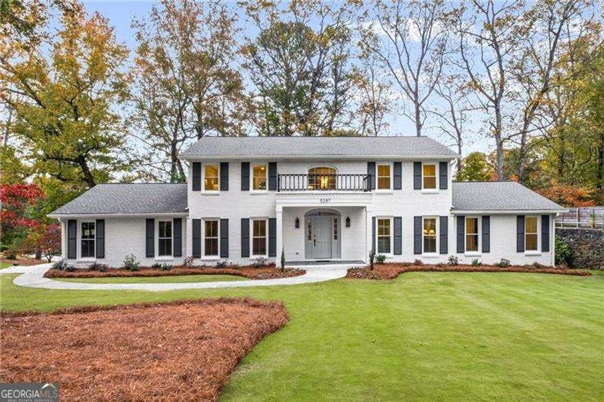 Updated to Perfection-Classic Elegance Meets Modern Comfort! Welcome to this stately three-level, all-brick residence set on an impeccably maintained corner lot with freshly landscaped grounds. From the moment you arrive, the home's timeless curb appeal and pristine presentation set the tone for what lies within. Step inside to discover a beautifully updated interior designed for both everyday living and gracious entertaining. The formal dining room  accommodates up to twelve guests, while the home offers a spacious living room in addition to a cozy fire-side family room with the convenience of a wet bar. The kitchen was redesigned to encourage gathering with family and friends. Enjoy hanging out around the over-sized quartz and white oak island while using your brand-new stainless appliances. The home also boasts a light-filled sunroom with vaulted ceilings and picture windows that bring the gorgeous fall foliage from the private backyard in--an ideal spot to savor your morning coffee or unwind at day's end.  The main-level bedroom suite, perfect as an optional primary on main, offers a private retreat complete with a generous walk-in closet and a stunning bathroom with double sinks and walk-in shower. Upstairs, you'll find equally impressive accommodations, including a stunning primary suite featuring a Calcutta gold marble bath with white oak cabinetry and quartz countertops. The two additional bedrooms are spacious and share a beautifully appointed bath with double sinks-perfect for family or guests. The newly redesigned daylight terrace level offers a brand new full guest bath and guest bedroom in addition to TWO large common areas and has access to the walk-out backyard and newly finished covered stone patio-ready to host your next game night or BBQ. Thoughtful updates, classic brick construction, and flexible living spaces come together to create a home that's truly move-in ready, and perfect for multi-generational living. Designer lighting, vibrant wallpapers, new cabinetry and hardwoods throughout are some of the updates you will appreciate, but don't miss the many other costly updates that have also been done such as new windows, updated electrical, all new plumbing and more. An added bonus-this property features a grandfathered private well for landscape irrigation, helping to keep your grounds lush while lowering utility costs. Ideally located close to shopping, dining, and everyday conveniences, this exceptional home delivers a rare combination of sophistication, comfort, and practicality-all in one remarkable address.