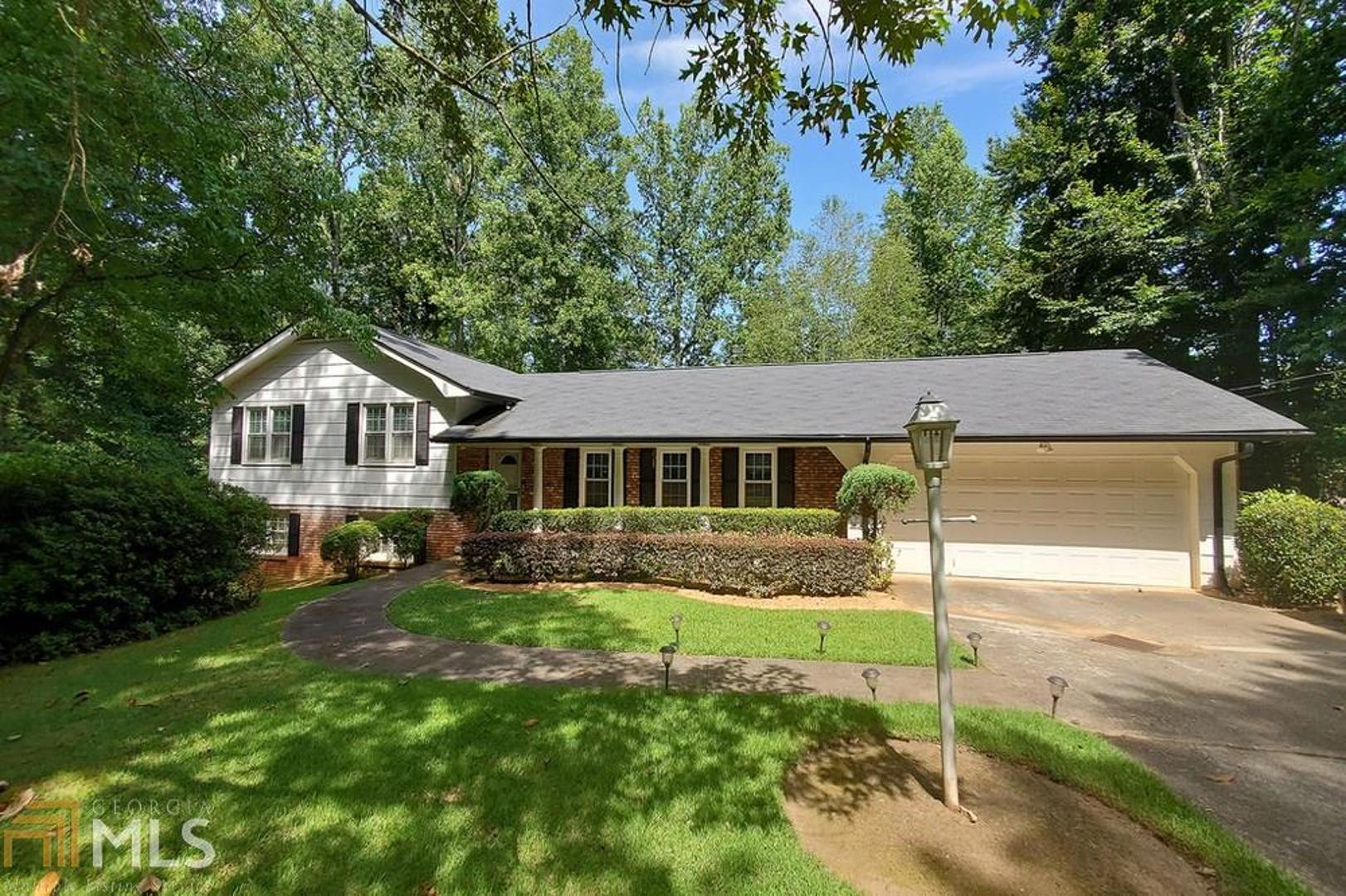 This Brick and frame split level with a finished basement sits on nearly an acre lot located in Southwest Atlanta's Loch Lomond Estates. Main floor boasts hardwoods throughout! Formal living and dining rooms. Family room with wood burning fireplace. Office, spacious eat in kitchen with double ovens, 2-car garage, and 2 patios . 4 bedrooms and 3 baths. Pack your bags and move in. This is a Must See!!!!