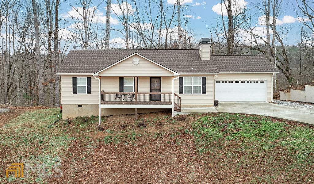 Come see this gem! 3 bed 2 bath 1232 square feet on 1.23 acres. This home features a seasonal mountain view from the back deck and a peek-a-boo mountain view from the rocking chair front porch. 2 car garage and custom upgrades throughout. Although built in 2020, there have been wonderful changes made such as granite countertops, LVP wide-plank flooring, custom tile shower, new light fixtures, new vanities, as well as a new kitchen backsplash and island. Gravel parking pad with RV electrical hookup has been added. This one won't last long!
