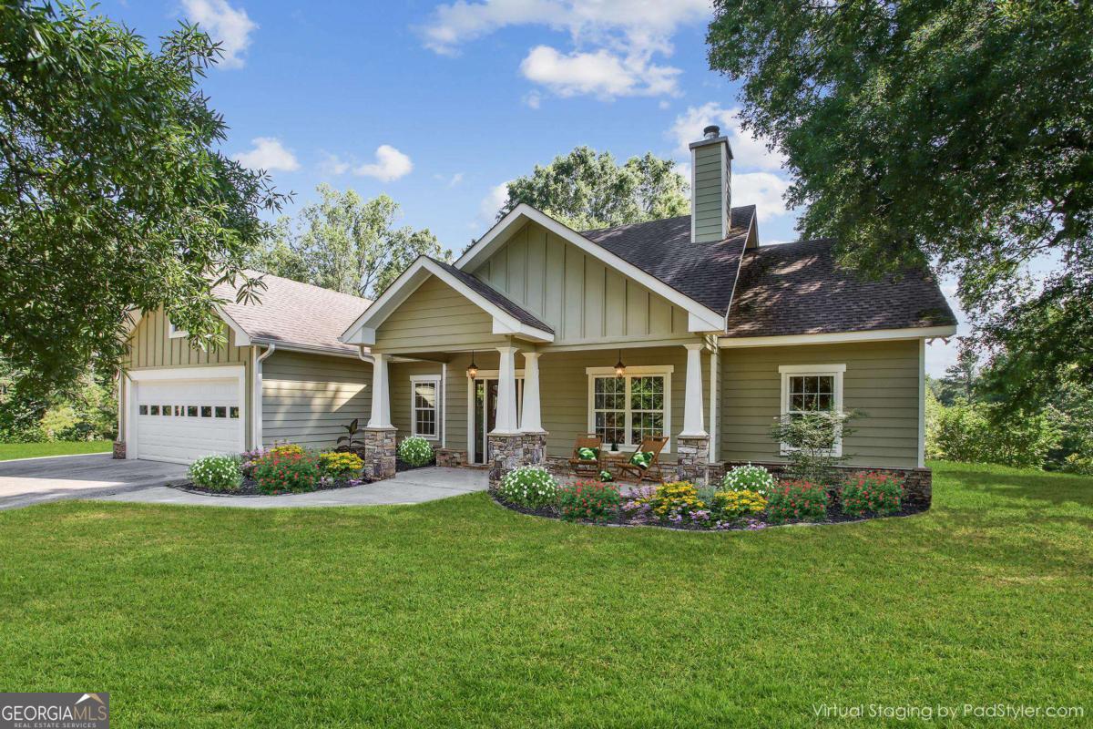 Tucked into the rolling countryside of Chattahoochee Hills, this newer construction home sits on nearly 3 acres of natural beauty and privacy-just minutes from the acclaimed Serenbe community and its restaurants, spa, boutique shopping, and weekend farmers market. Inside, the home offers an inviting open-concept layout, anchored by a vaulted living room with a wood-burning stove that adds warmth and character. The spacious primary suite features two generous walk-in closets and a serene ensuite bath. A two-car garage provides ample storage and everyday convenience. Surrounded by protected rural zoning that ensures the landscape will remain unspoiled for generations, this property is also minutes from Bear Creek Nature Center and the scenic trails of Cochran Mill Park. Less than 30 minutes to Hartsfield-Jackson Atlanta International Airport, this location offers the perfect blend of peaceful country living and modern accessibility.
