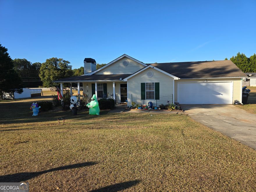 Your Home Awaits You in this Beautiful 3 Bedroom 2 Bathroom home that features Country Living. The owner's suite features a nice sized bedroom and bathroom with double vanities and separate shower. You also get a Themed kids room already decorated for your little one. The Great Room is spacious featuring a wood burning fireplace.  The kitchen has an area for bar stools or a space for a table for intimate dining. The little over 1-acre lot includes a patio and a workshop.  Parking includes a 2-car garage and several spaces in the driveway.  Lastly, you have your OWN Banana Tree in your yard. Book your appointment NOW !